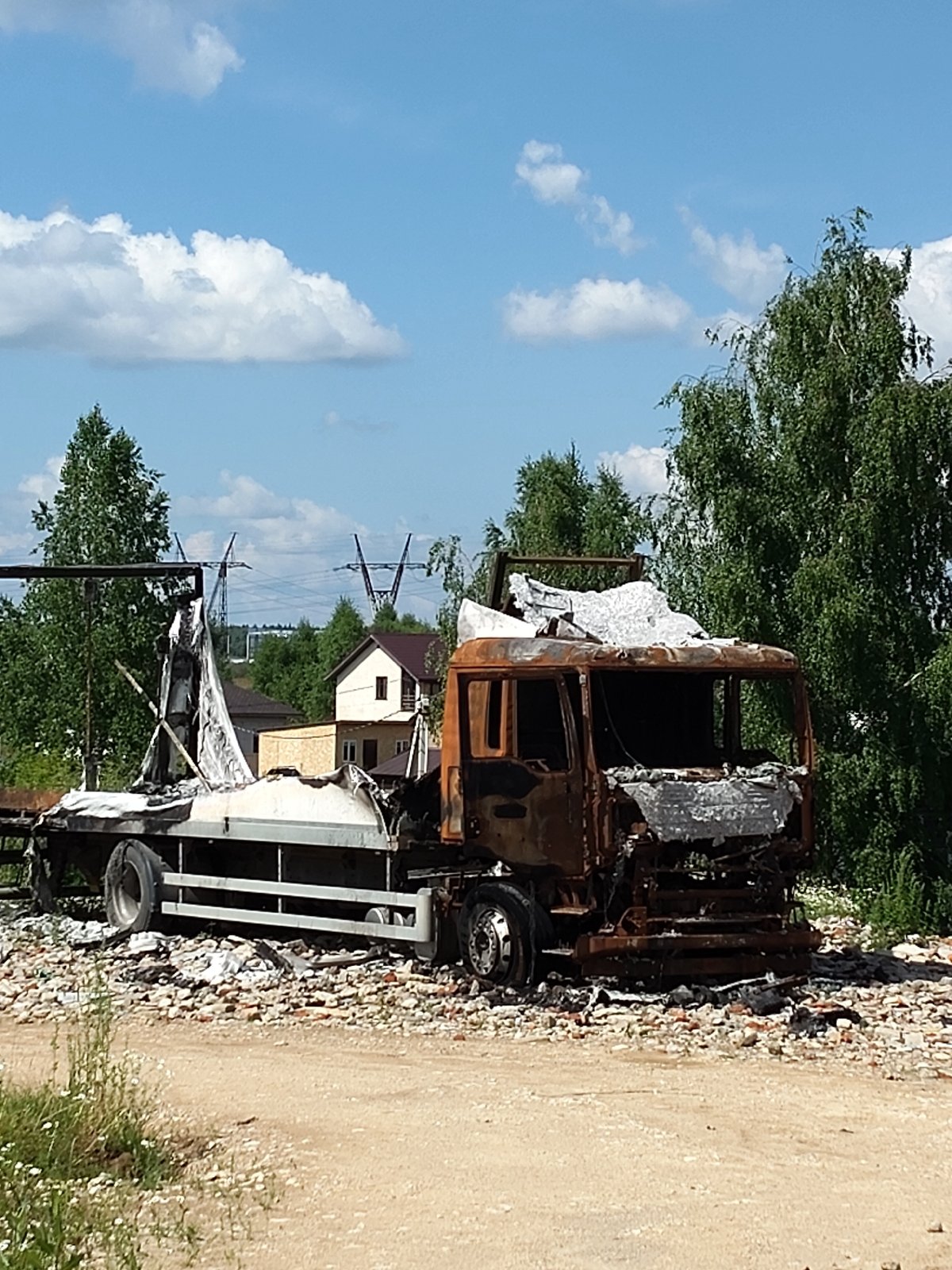 Burned truck and calm surroundings in Chekhov, Russia