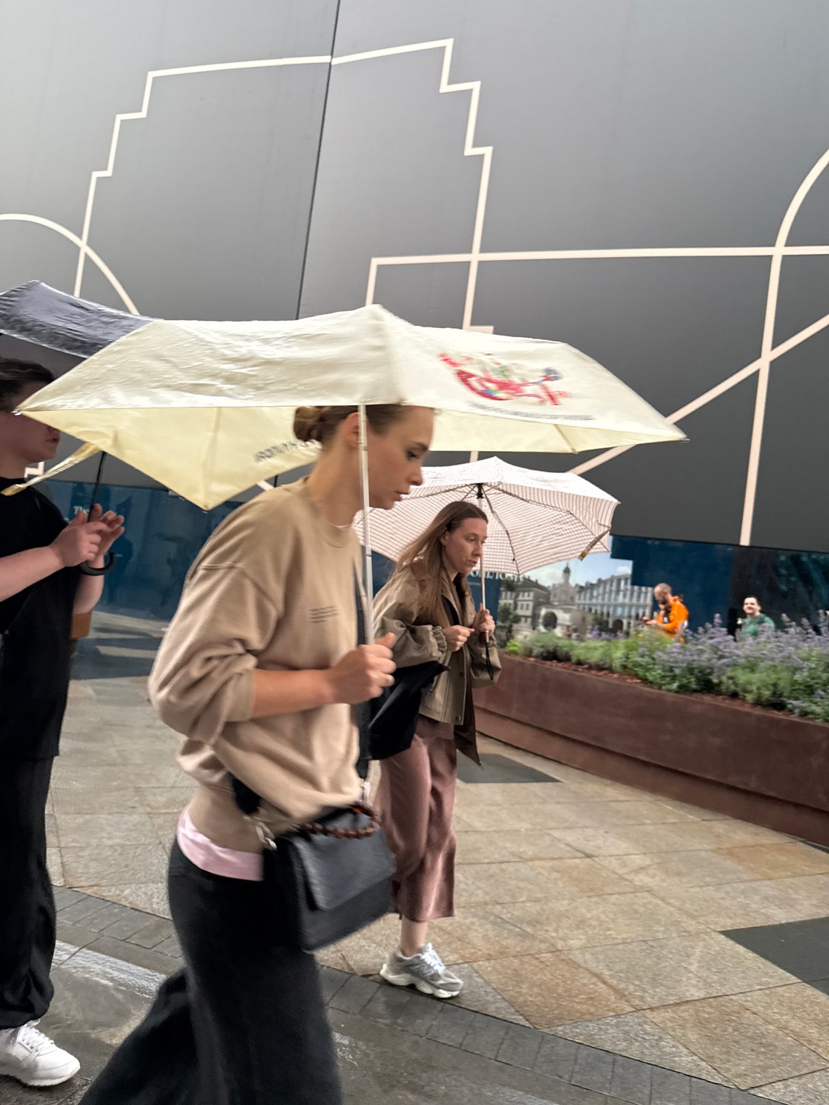 Rainy afternoon foot traffic on a Moscow city street