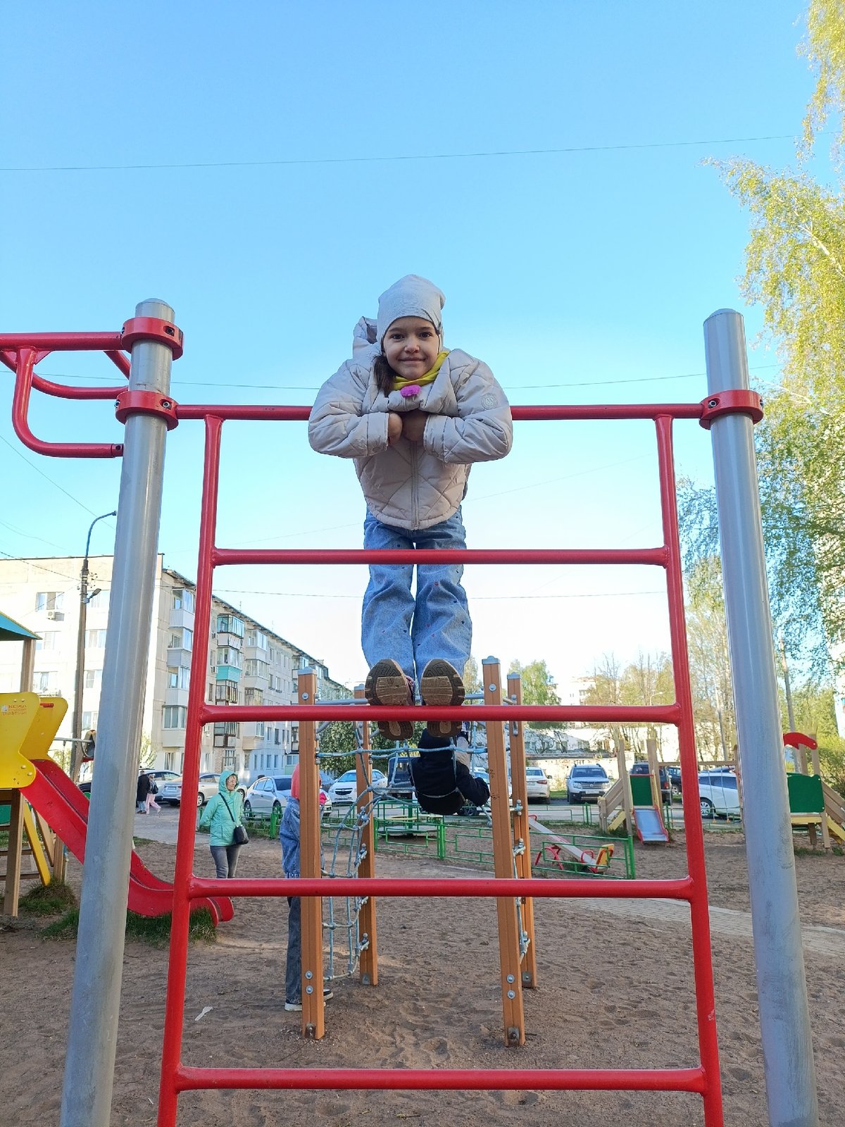 Family playground gathering in Chaikovsky includes grilling, children's play