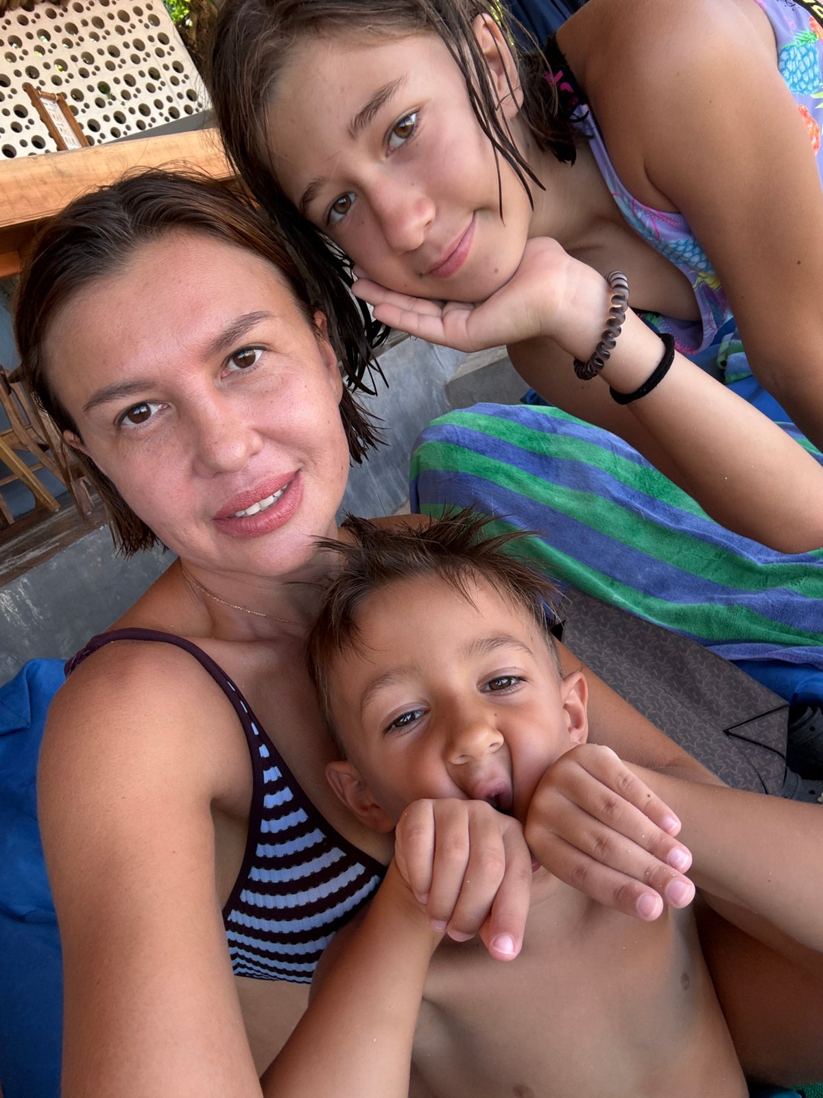 Family enjoys early morning beach time in Kuta Selatan