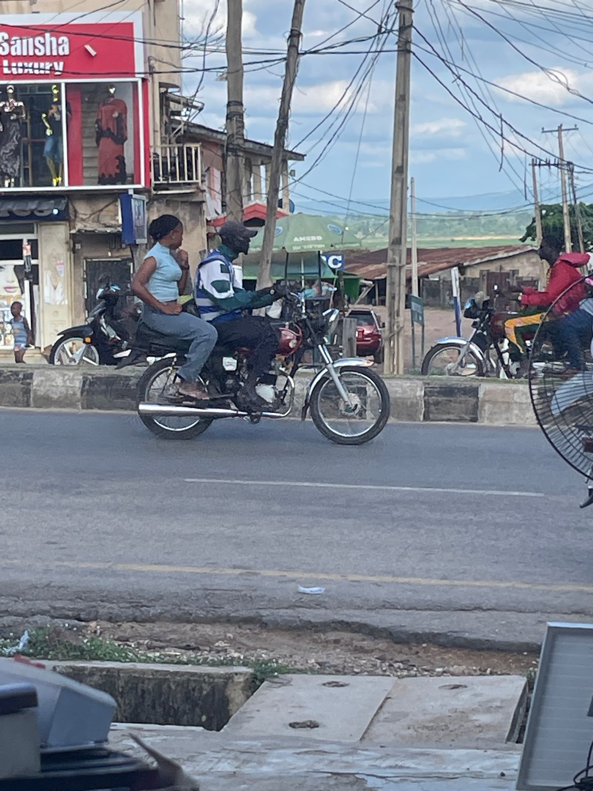 Goats, rickshaws, and street life in a busy urban stretch