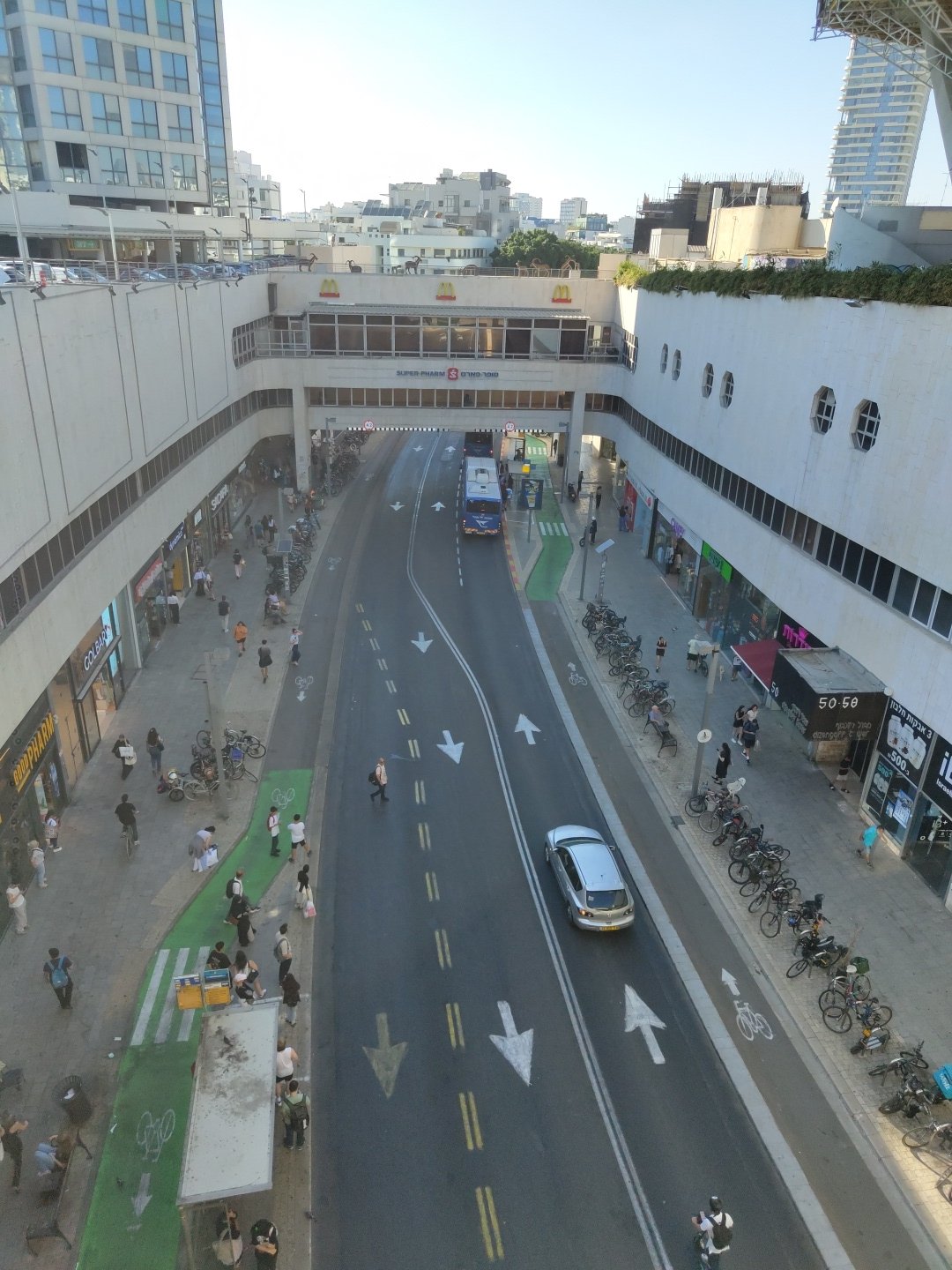 Azrieli area streets and a busy indoor lap pool, Tel Aviv