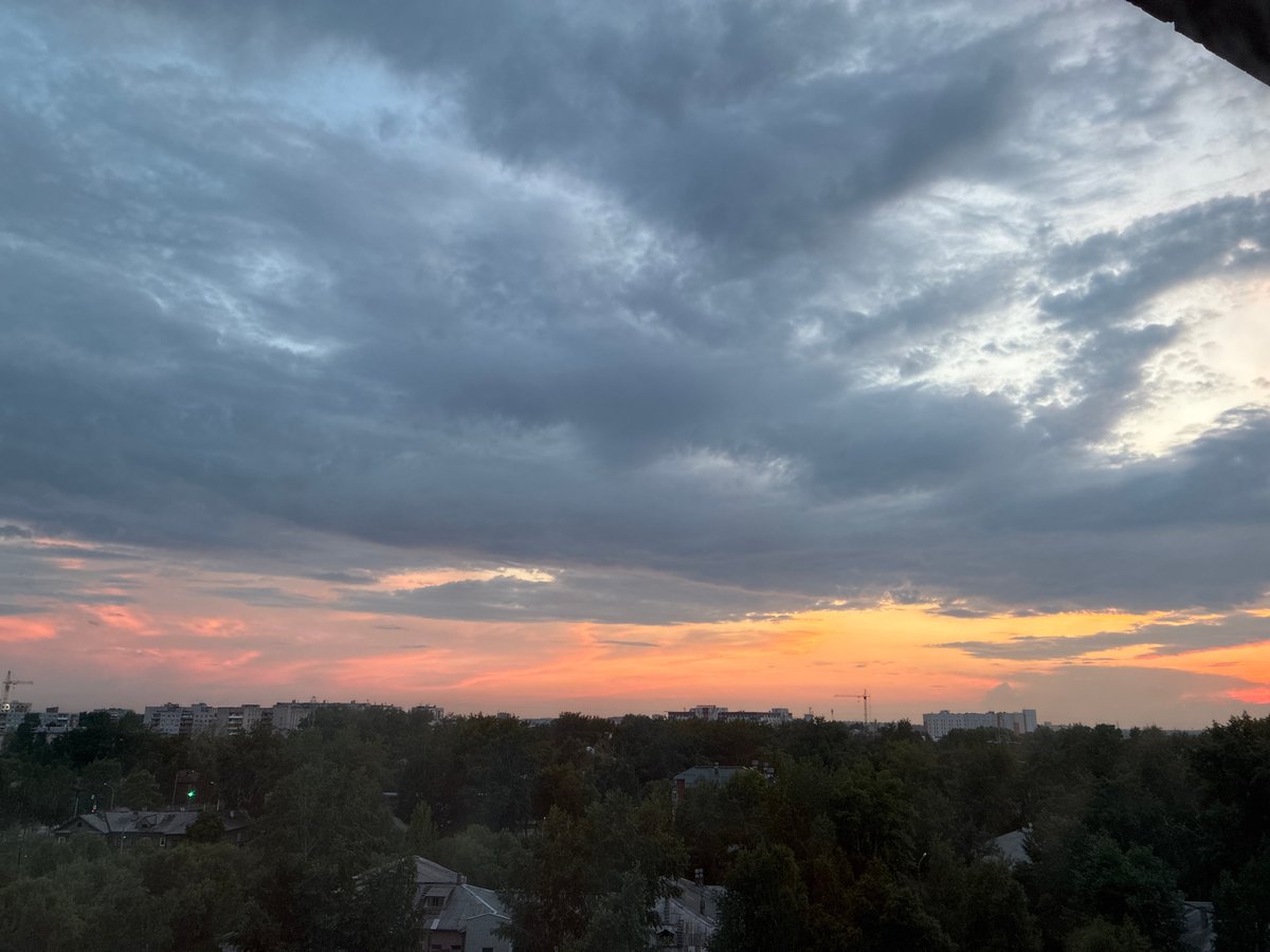 City skyline at dusk, clouds and color across two hours