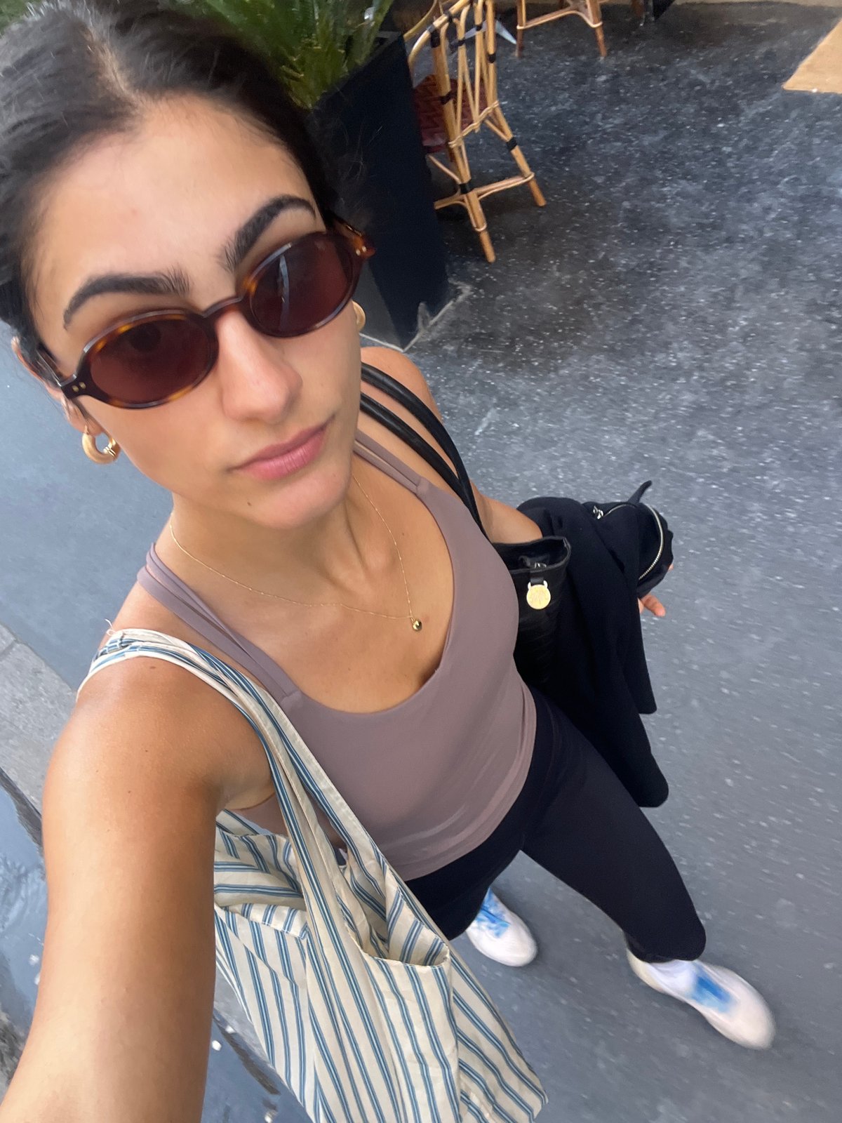 Tourist documents Paris historic building visit with selfies
