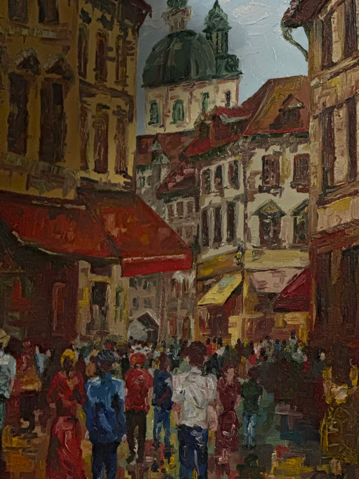 Art collection with cityscape paintings displayed in Puebla