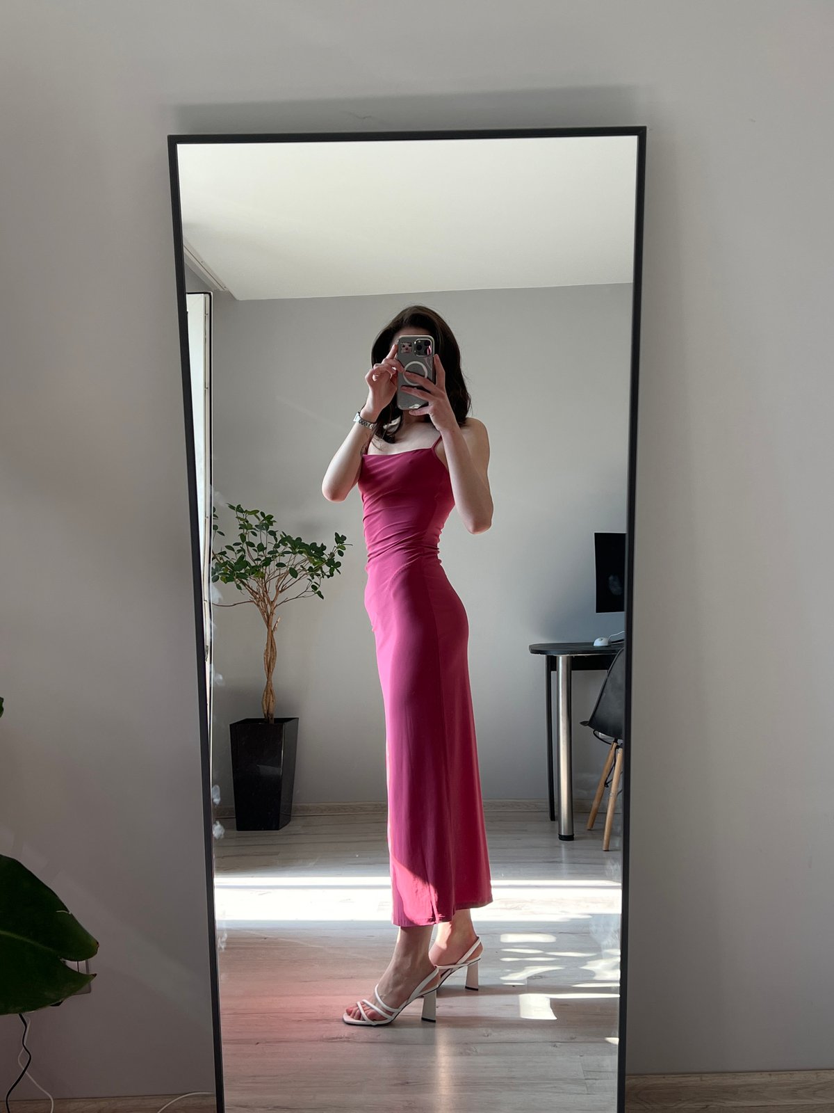 Woman takes morning mirror selfies in Ukrainian apartment