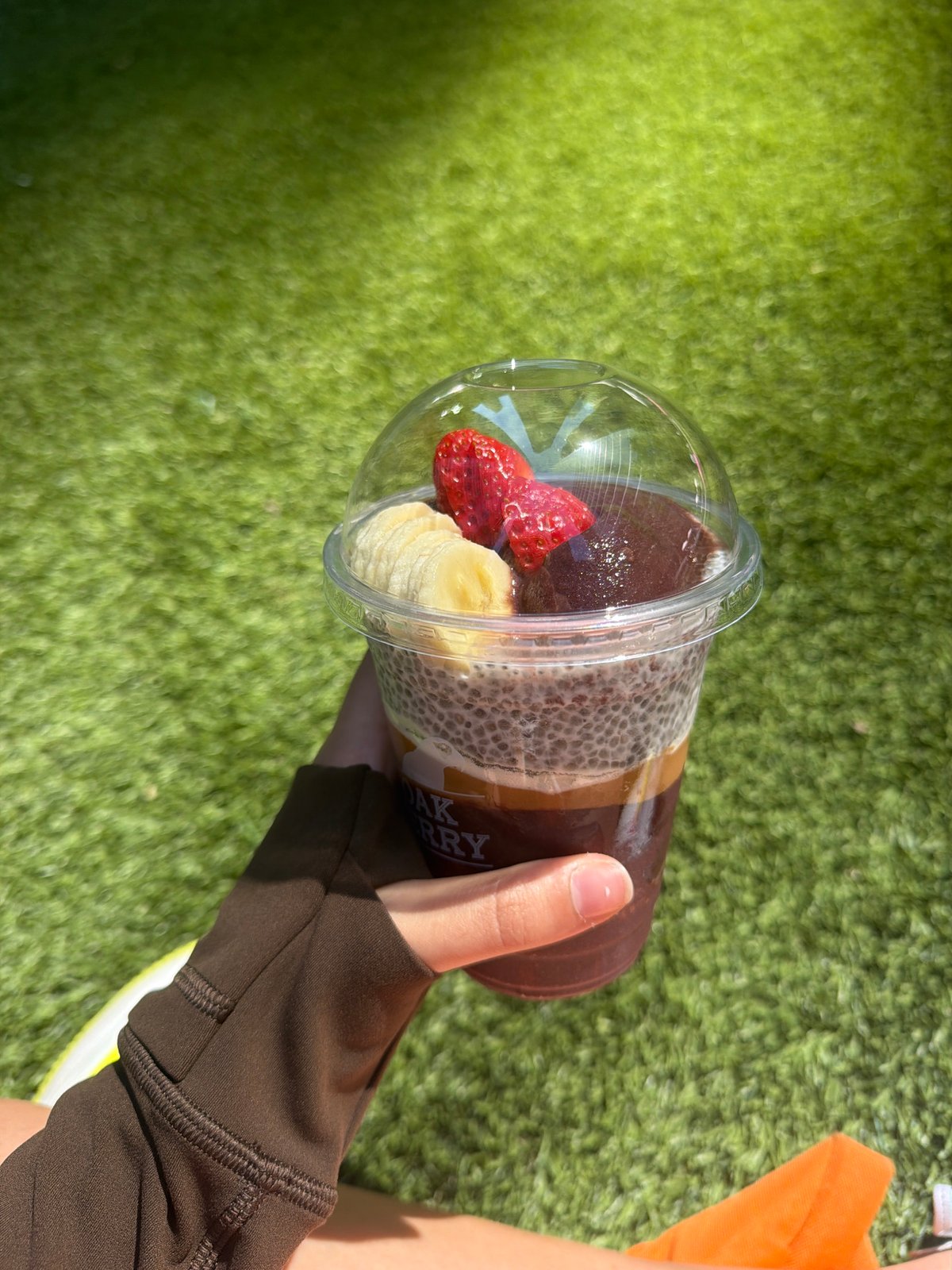 Toronto resident enjoys acai bowl near CN Tower downtown