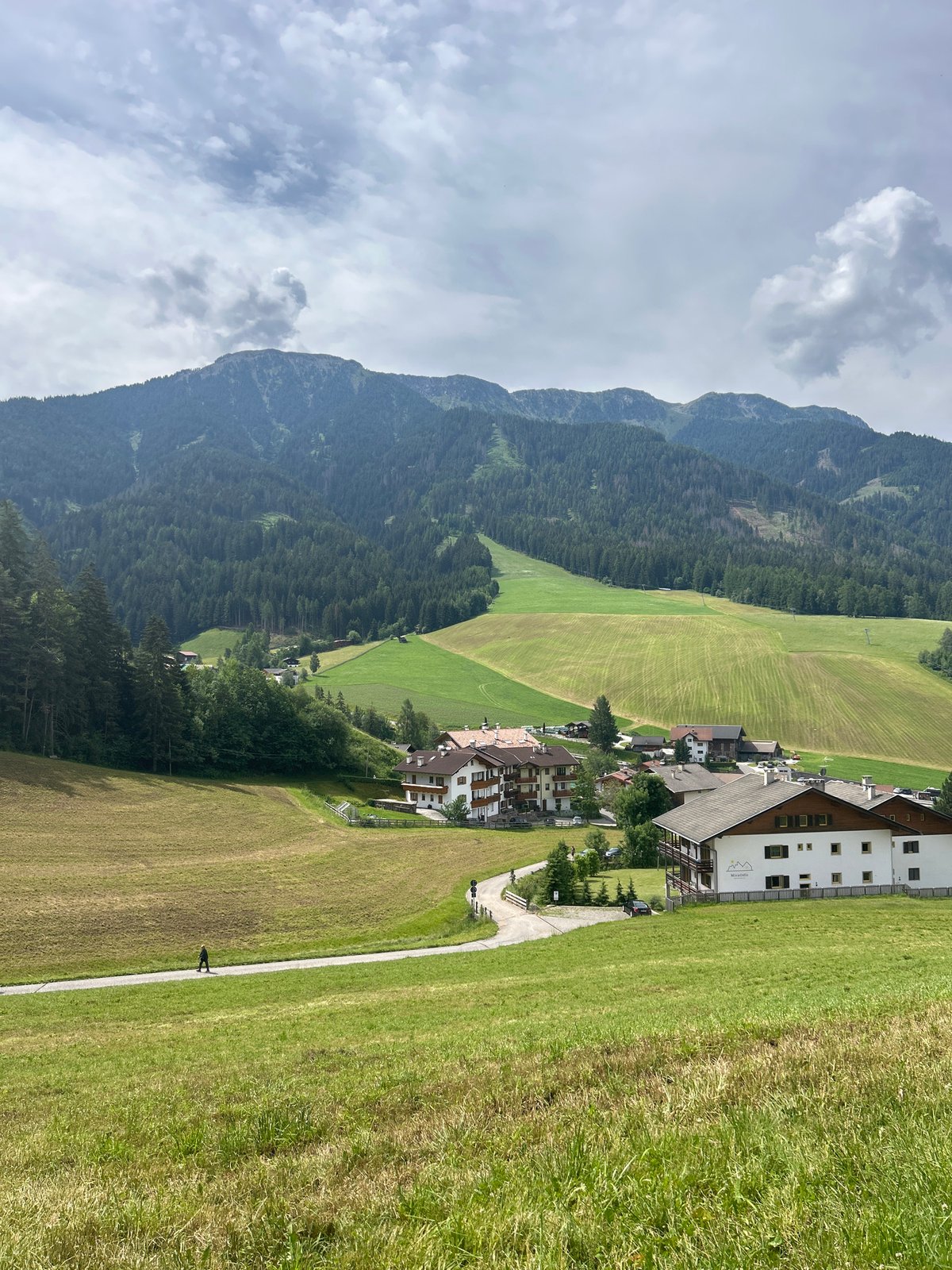 Morning walk through an Alpine village nestled below mountain peaks