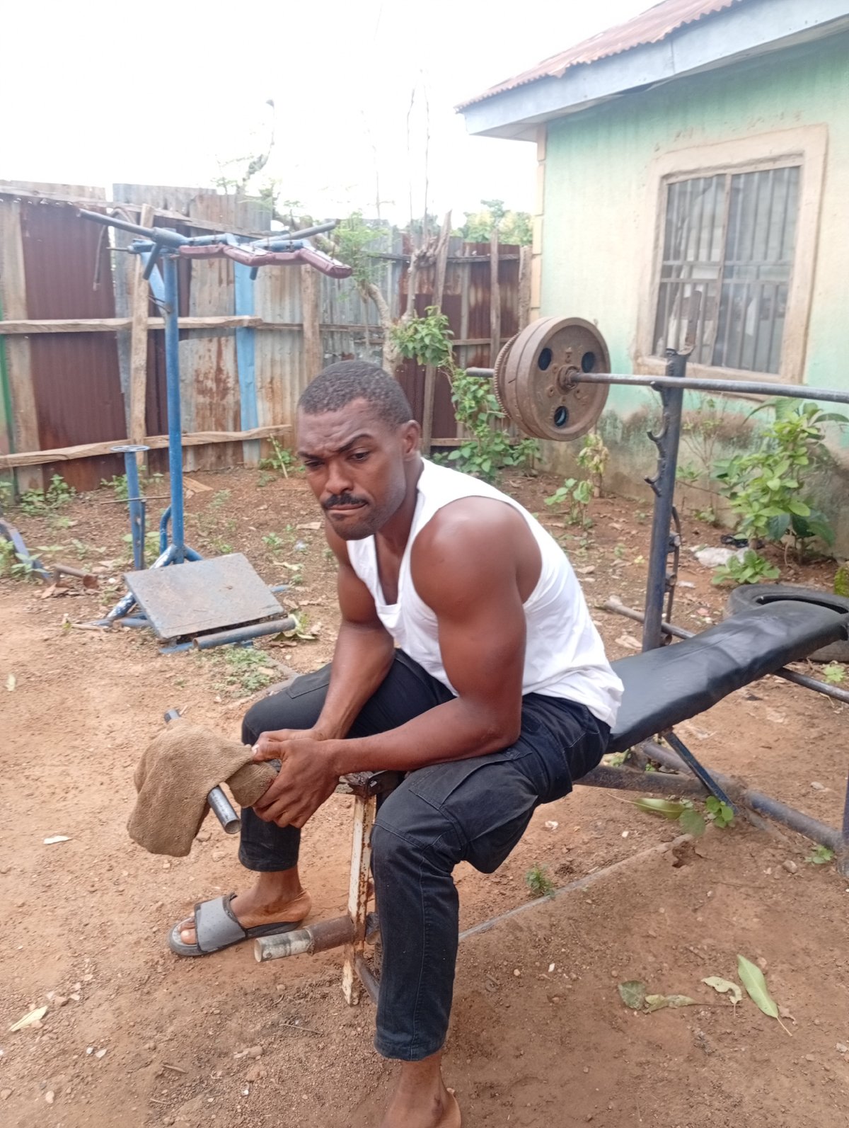 Men workout at makeshift outdoor gym in Akwanga Nigeria