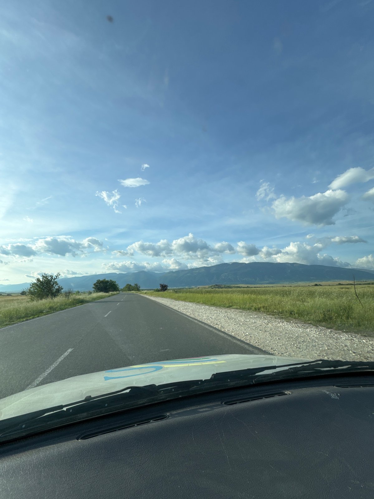 Driver documents scenic mountain road journey in real-time