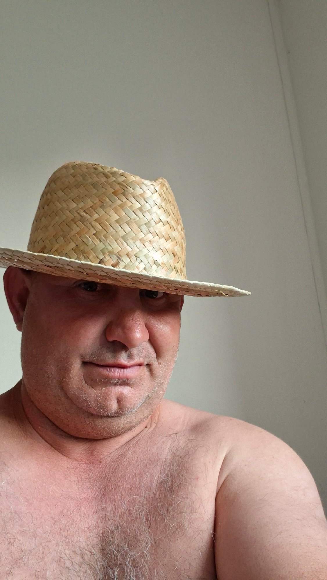 Straw hat selfie session at home in Hîncești, Moldova