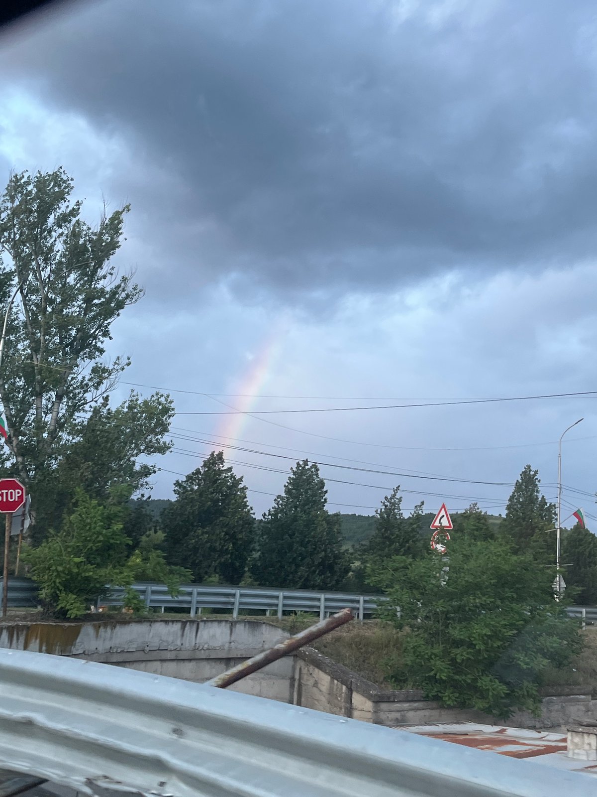 Rainbow appears over Simitli, Bulgaria amid cloudy skies