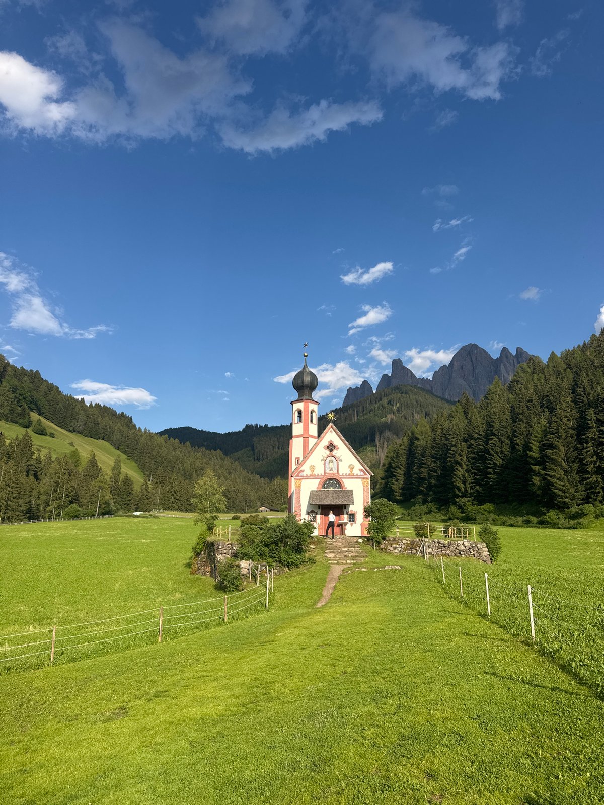 St. Magdalena Church framed against the Dolomites, Val di Funes