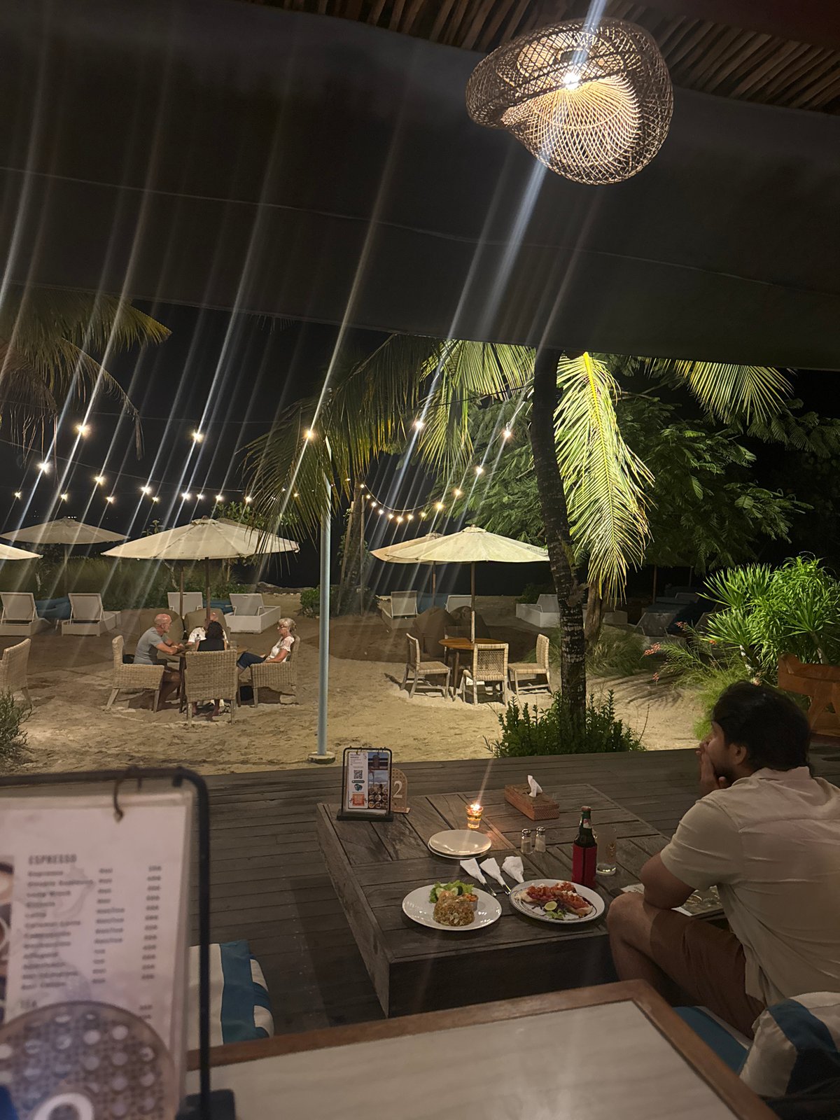 Evening dining and live music at Nusa Penida beachside restaurant