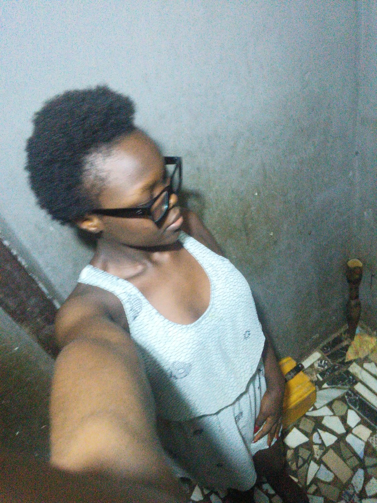 Selfie session in a dimly lit room in Onitsha, Nigeria