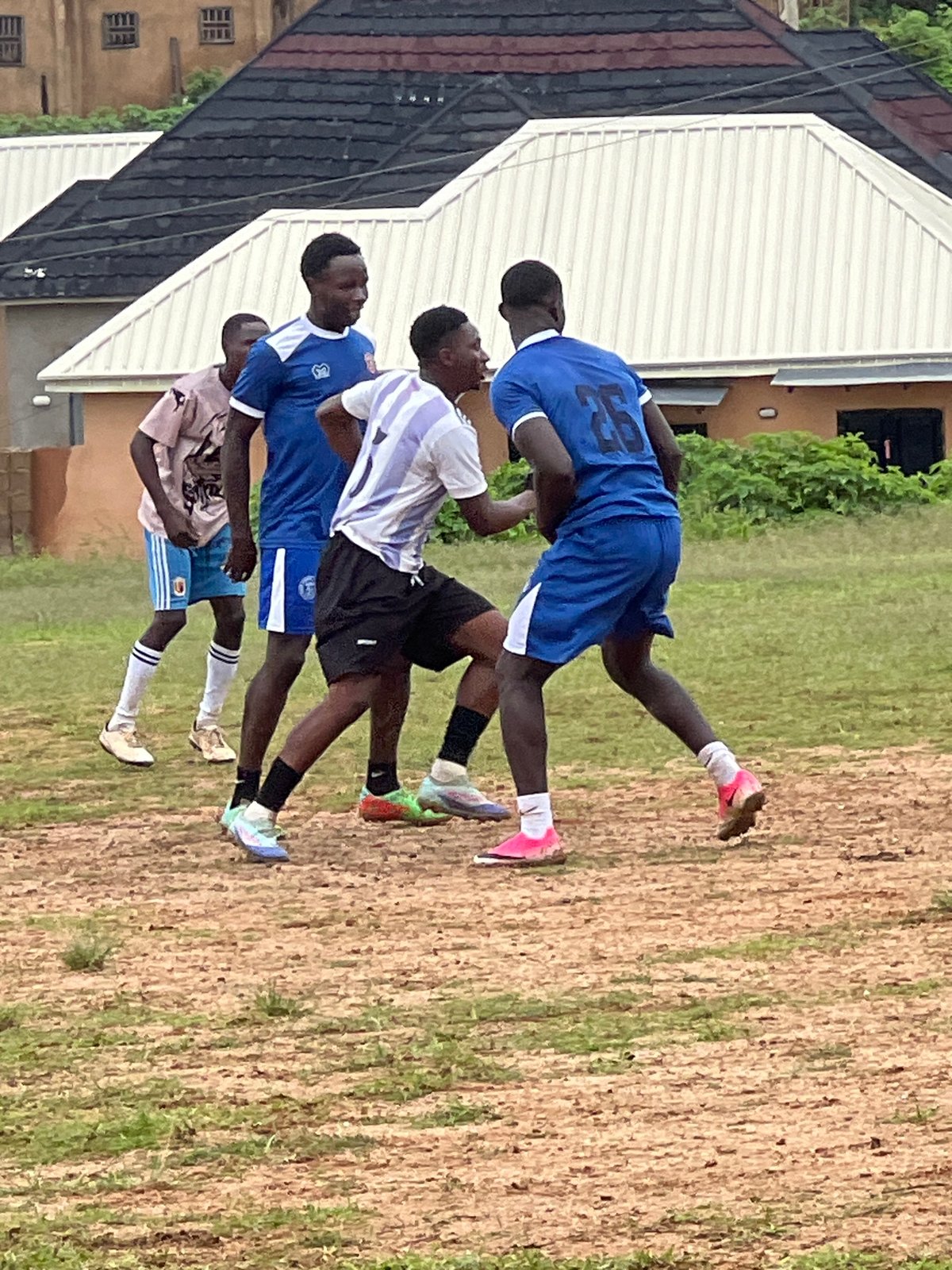 Pickup soccer on a dusty field in Jos, Nigeria