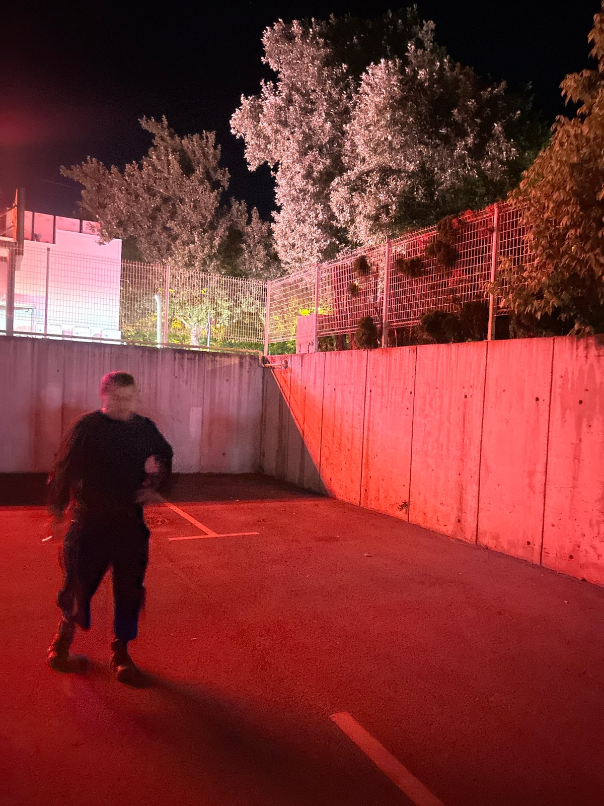 Nighttime pedestrian observed on illuminated street in Sliven, Bulgaria