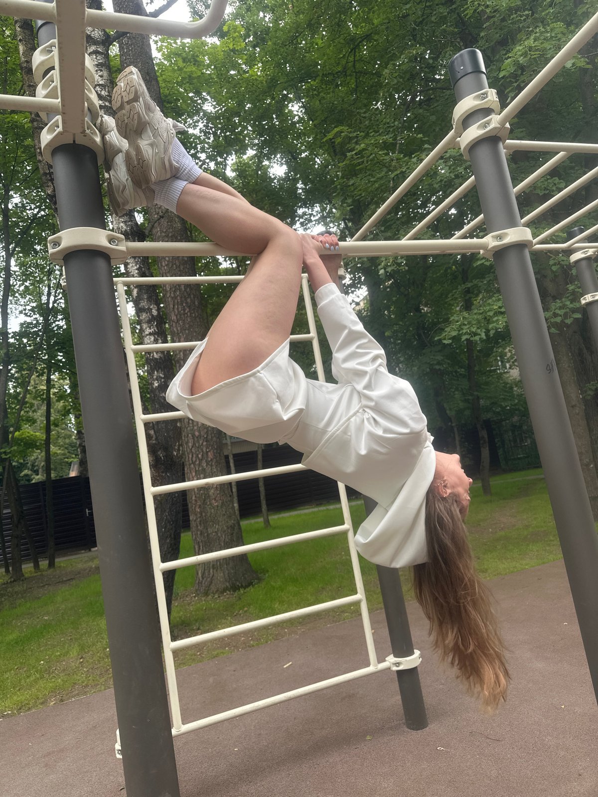 Gymnastic session on outdoor bars in Khimki park
