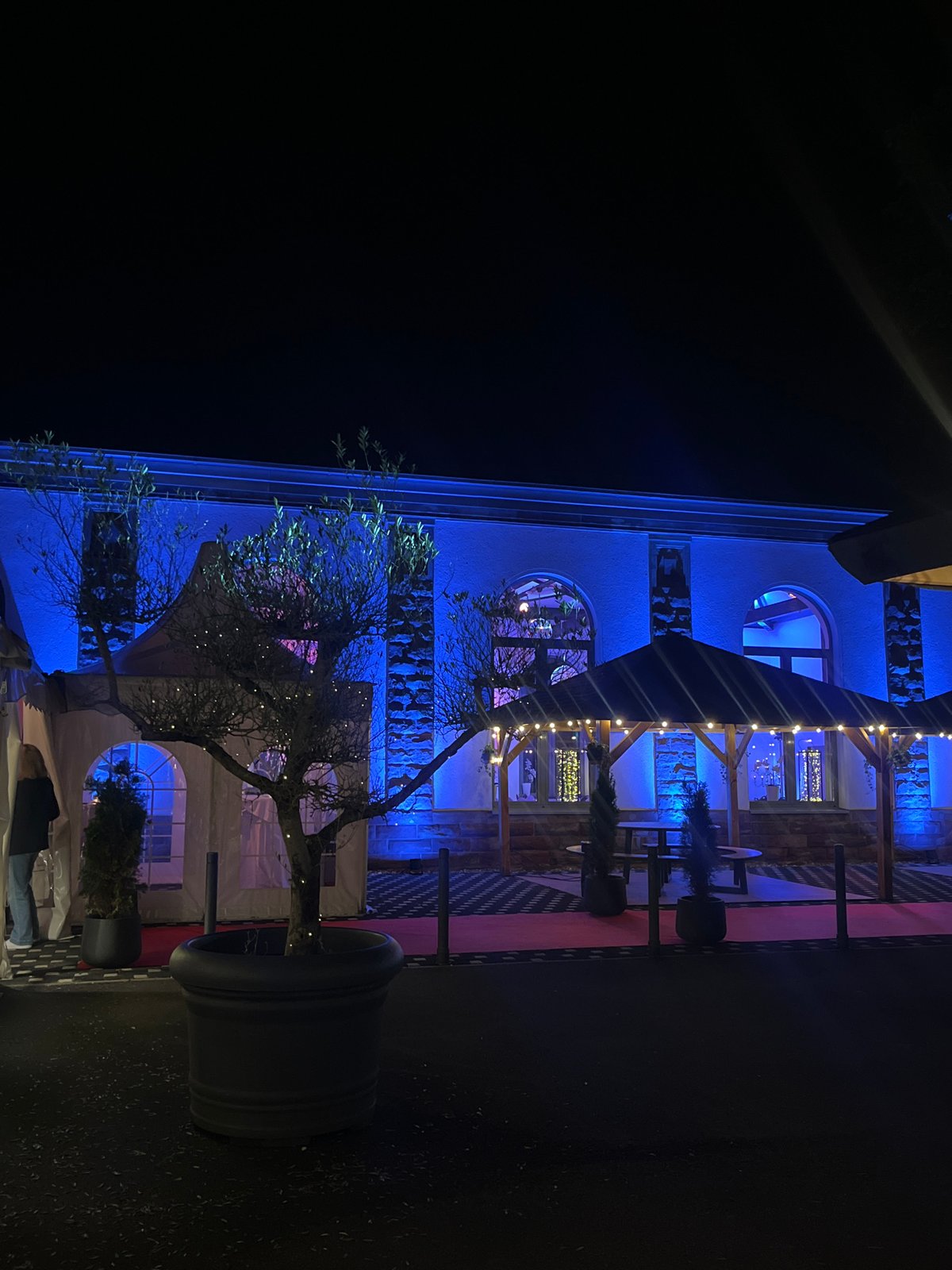 Building illuminated with colorful lights in Saarbrücken nighttime display