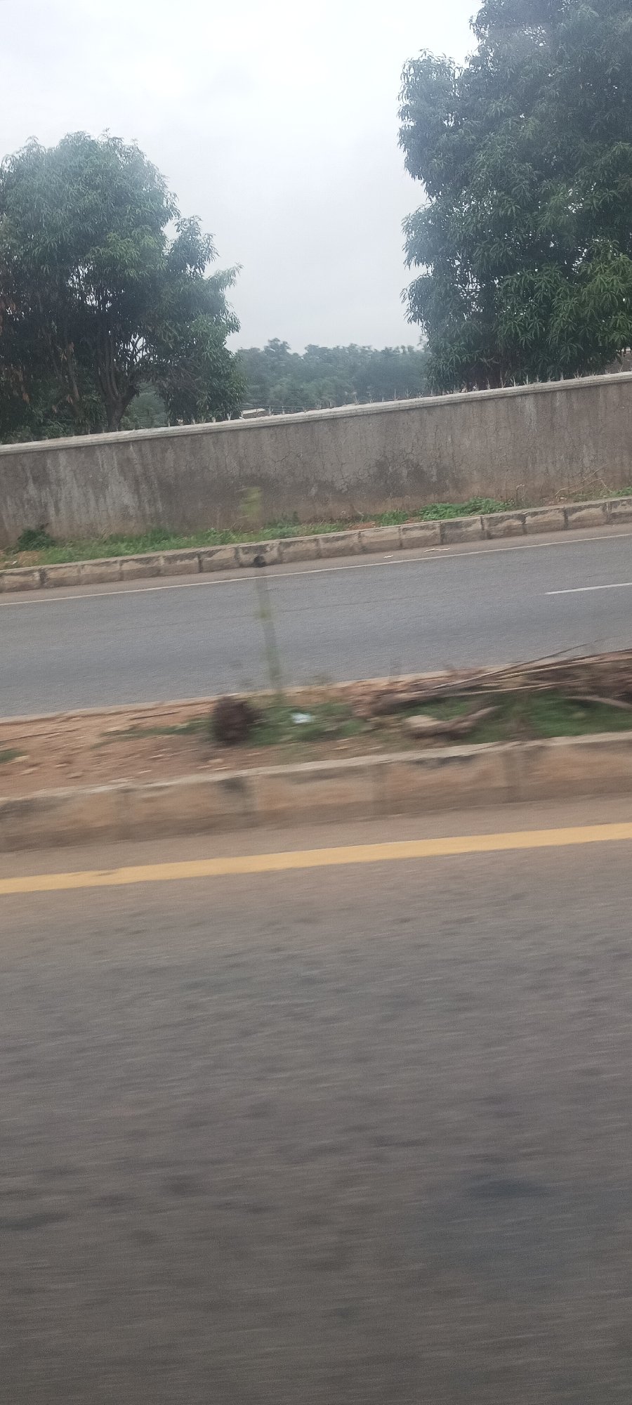 Morning drive through Jos, Nigeria captured in motion-blurred roadside sequence