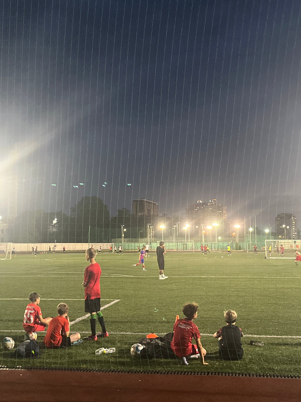 Twilight along the Kuban River, Krasnodar, with soccer and street scenes