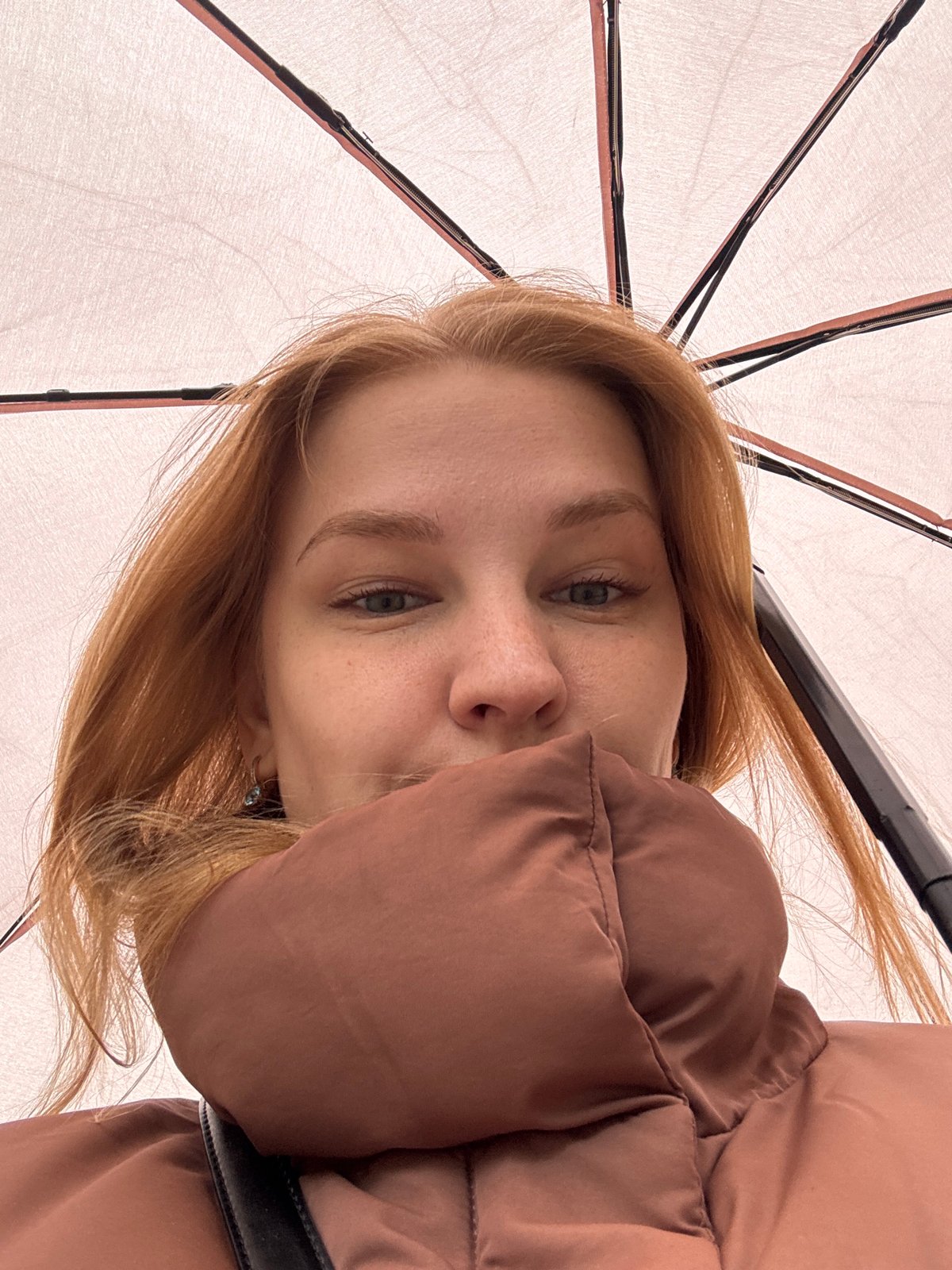 Woman photographed with umbrellas in early morning Yaroslavl