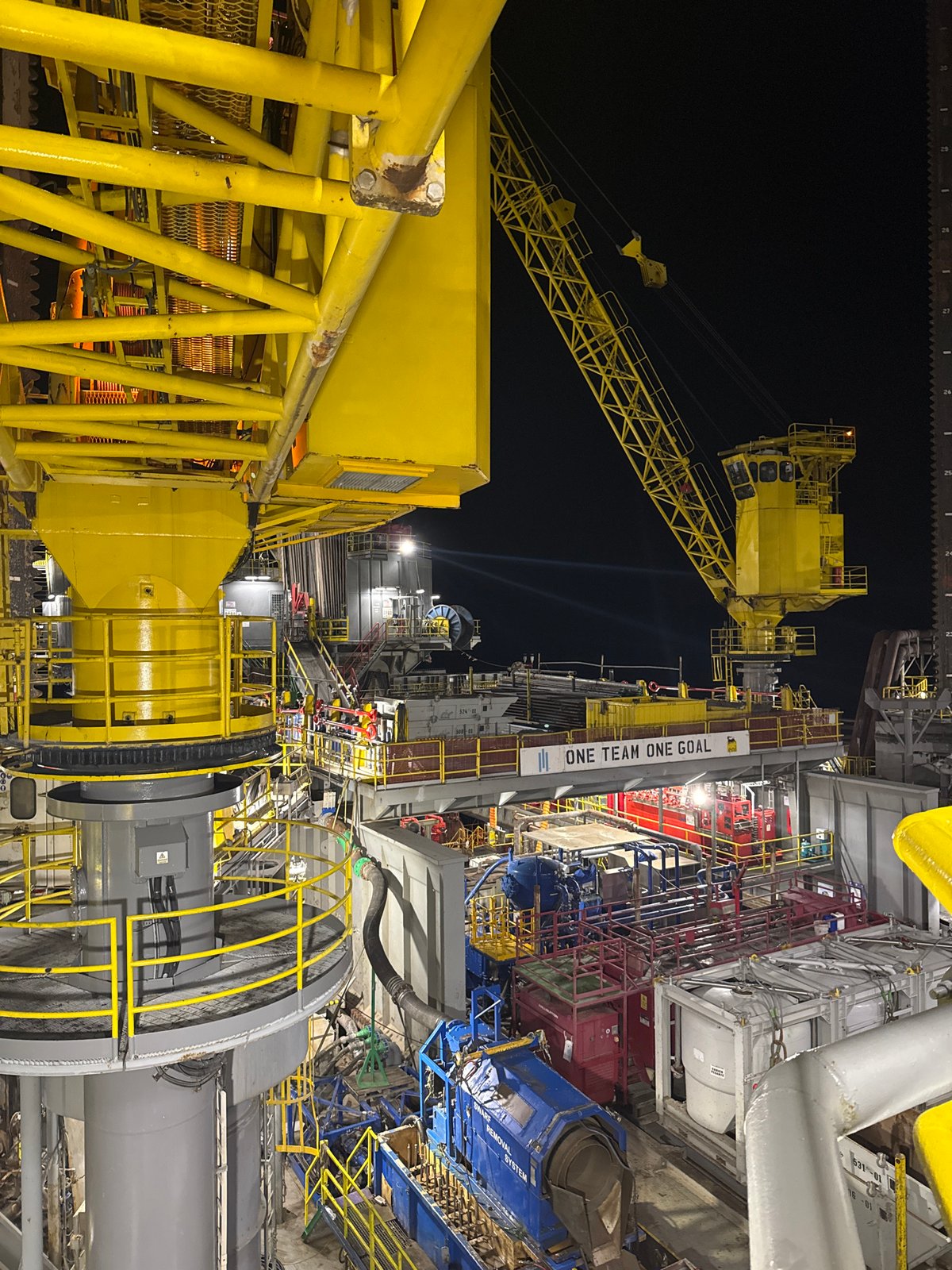 Offshore oil rig operations documented at night in Italy