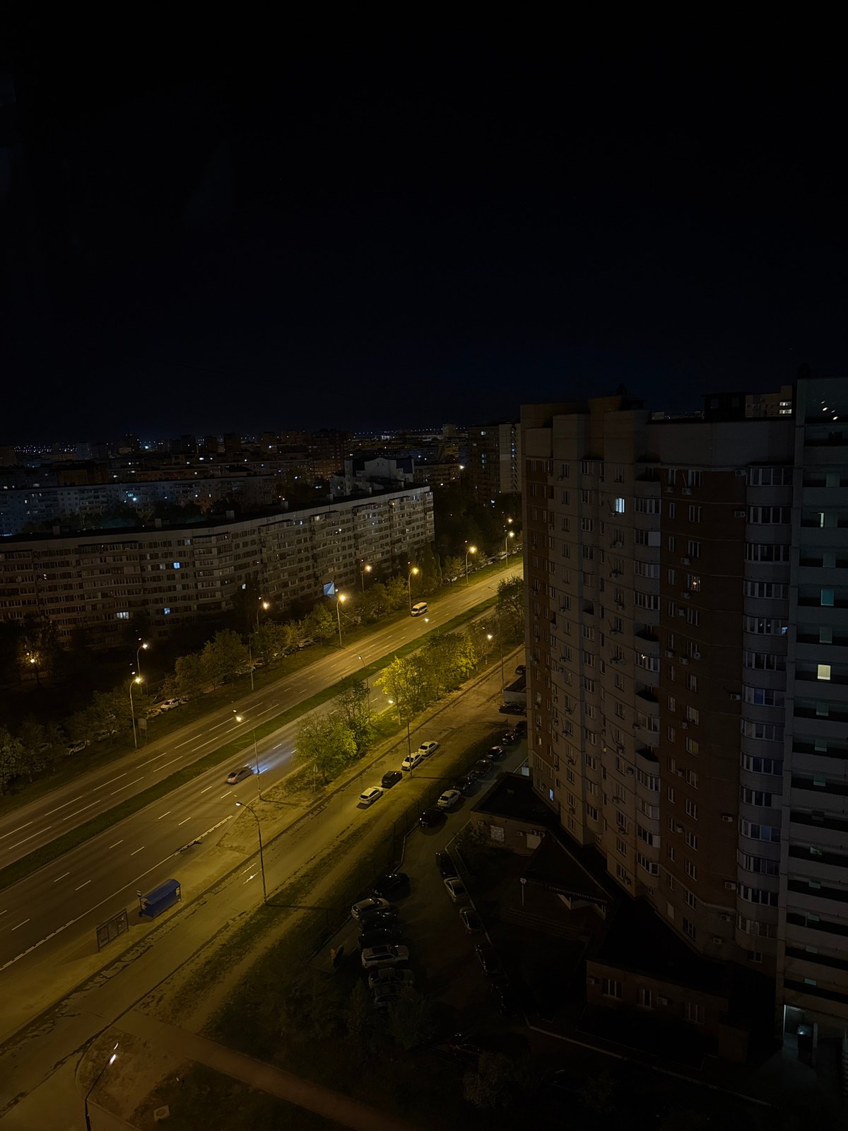 Night view captures illuminated apartment blocks in Tolyatti, Russia