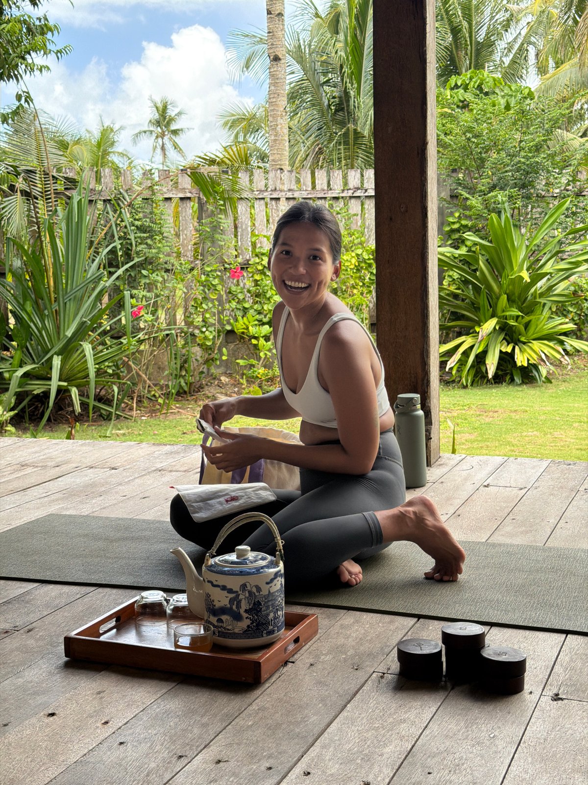 Woman practices yoga on deck in General Luna