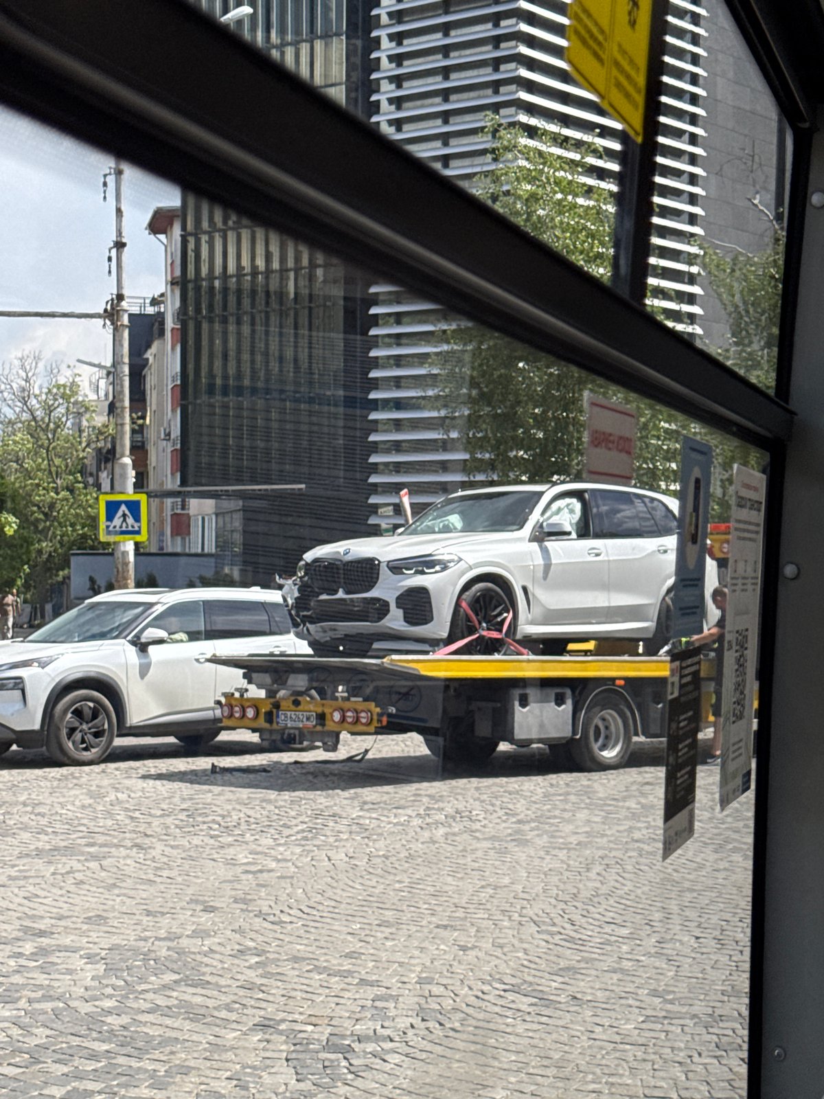 Damaged BMW towed from Sofia street after apparent accident