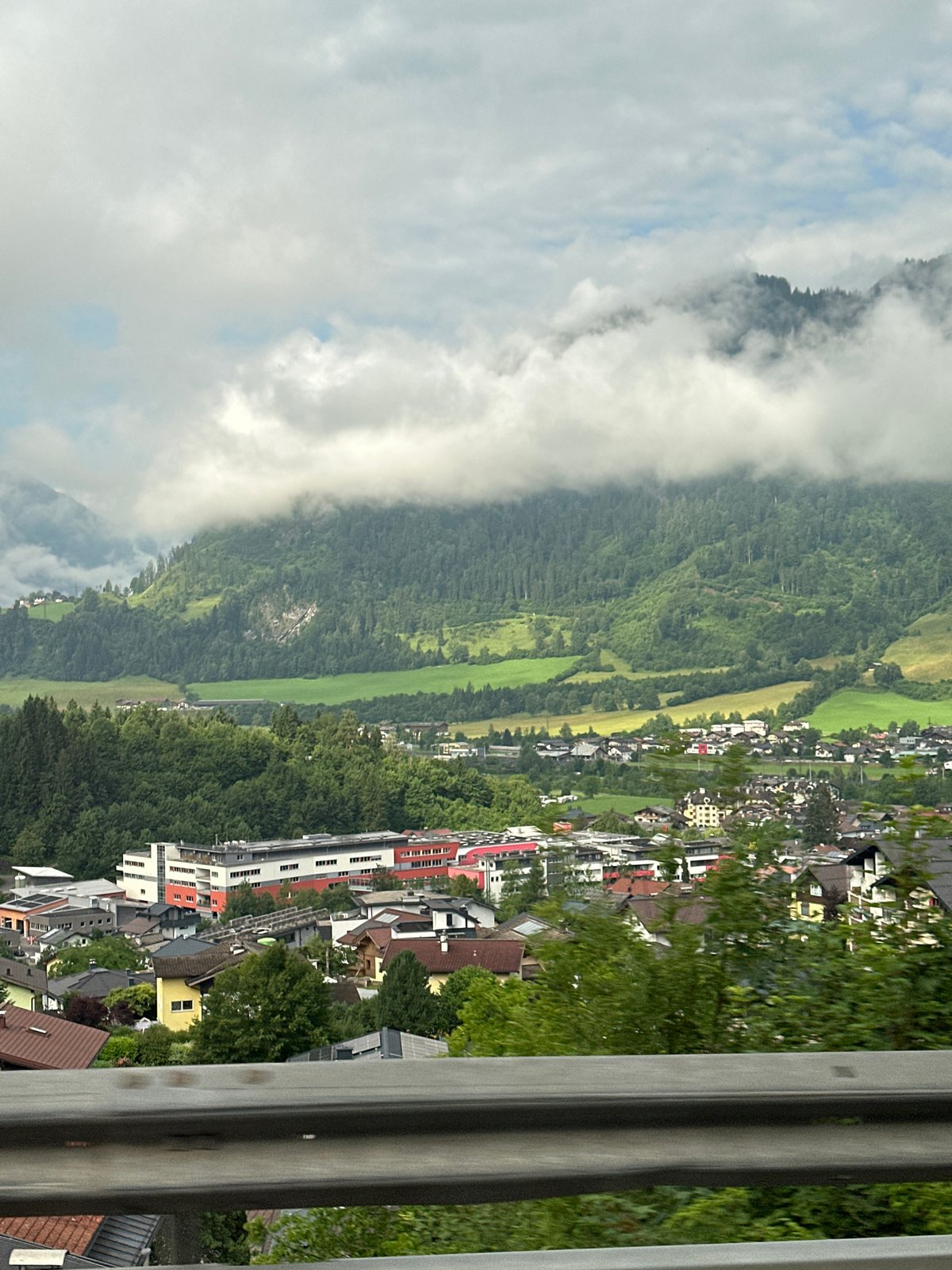 Overcast morning over forested mountain slopes in the Austrian Alps