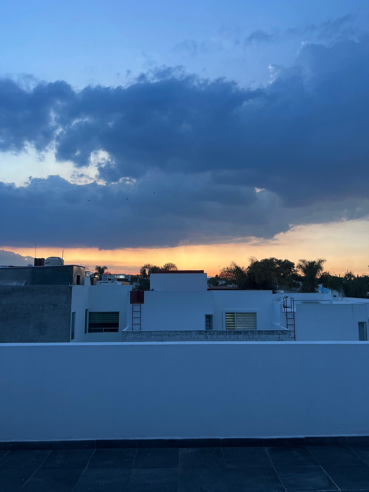 Dramatic sunset with storm clouds observed over Cholula, Mexico