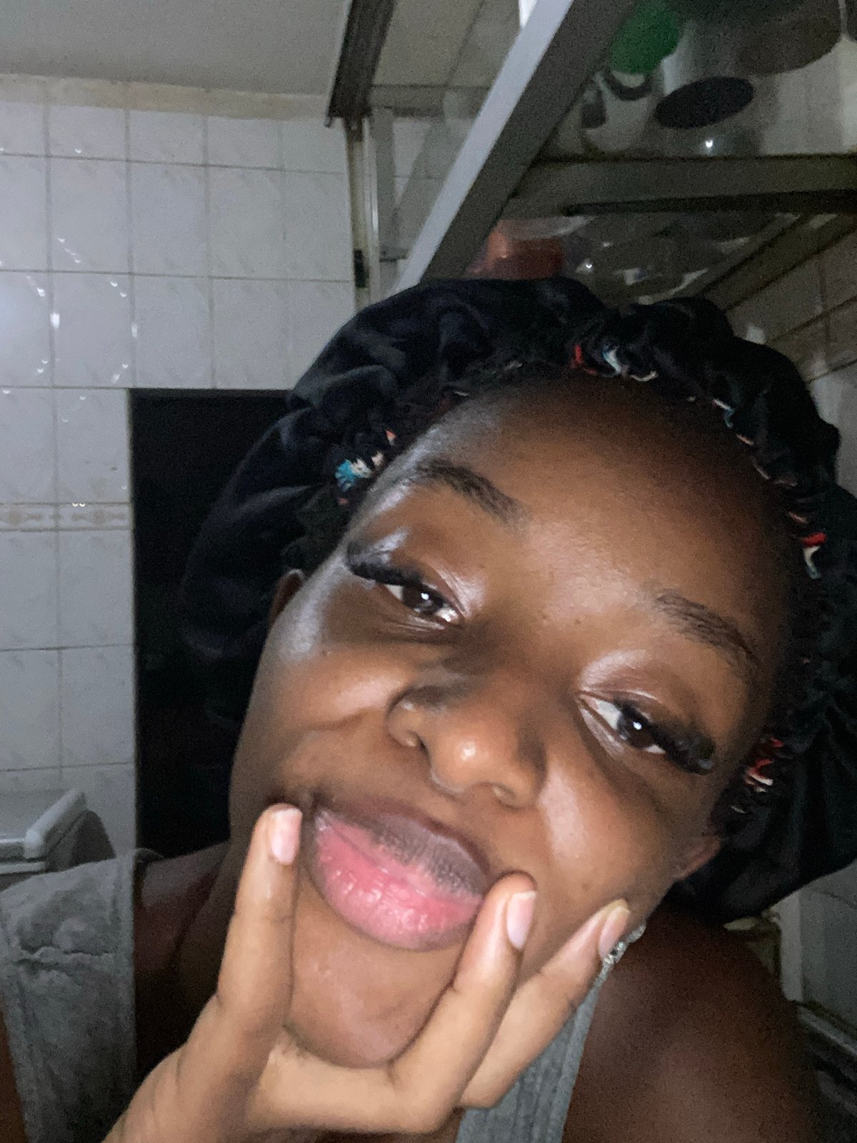 Woman documents evening self-portrait session in Jos bedroom