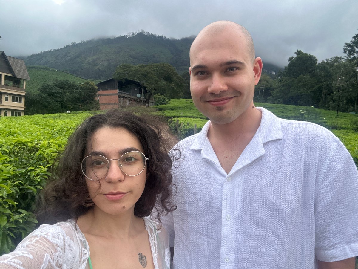 Tourists photograph tea plantations in Kerala hill stations