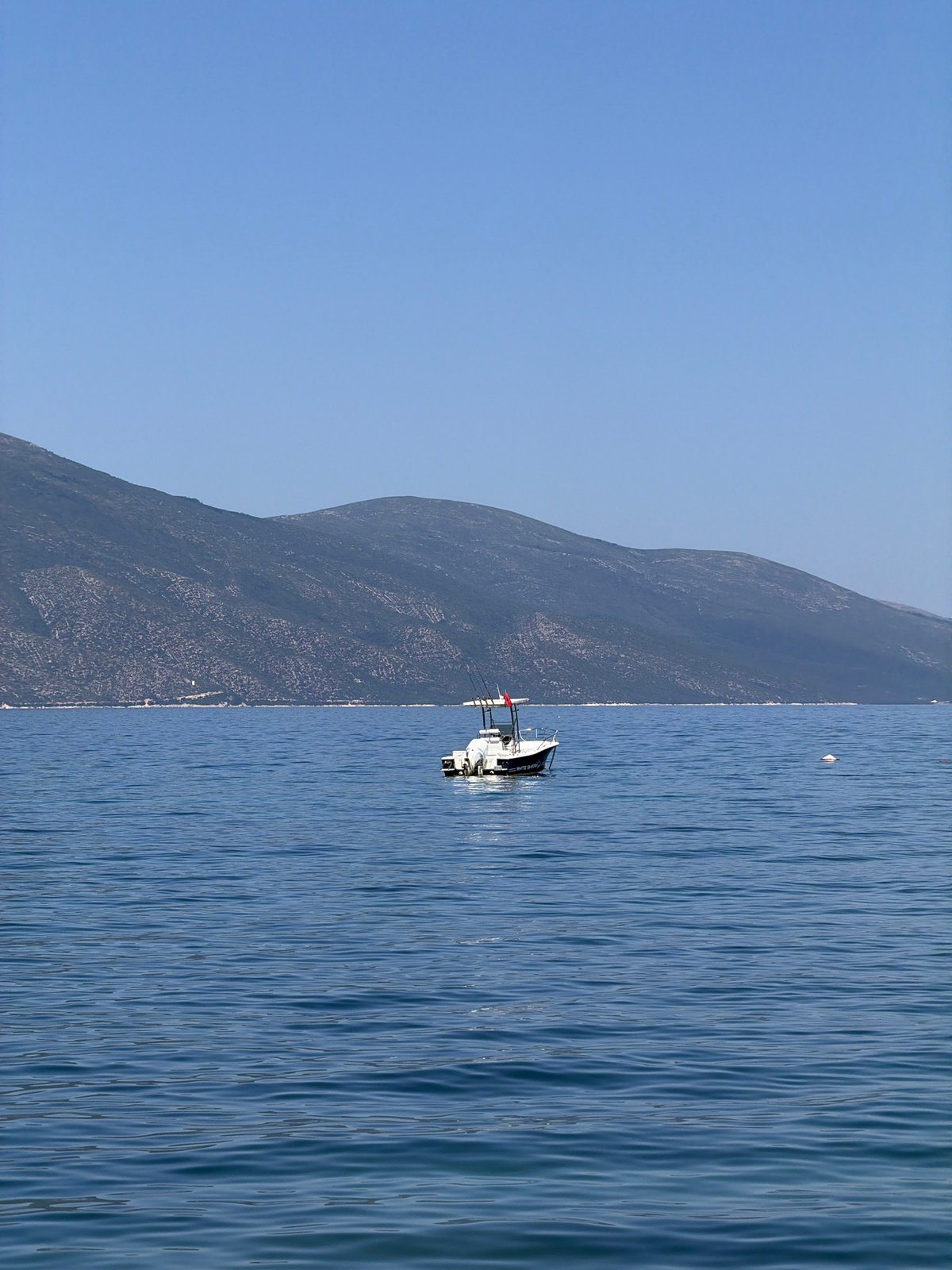 Jumping and swimming off a pier in Orikum, Albania