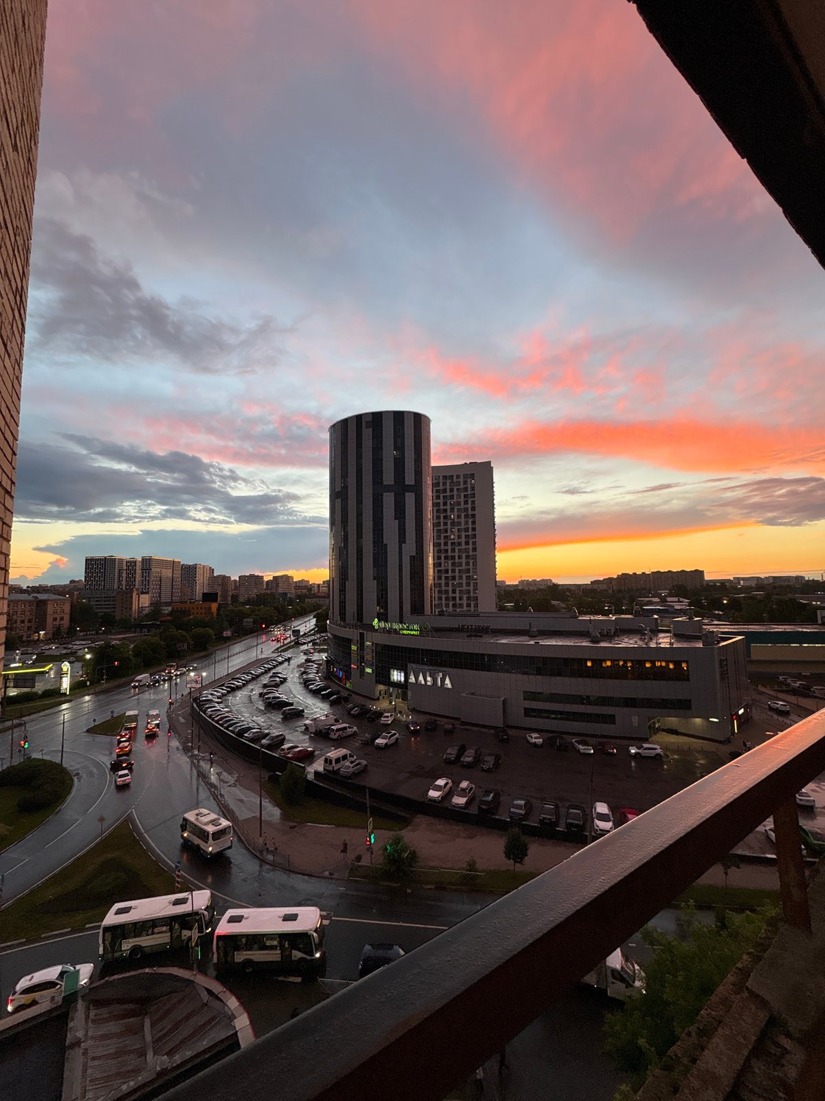 Sunset over Mytishchi with dogs, towers, and dramatic skies