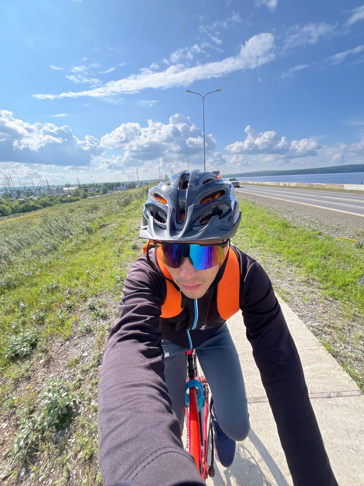 Bicycle ride along waterfront path in Chaikovsky, Russia
