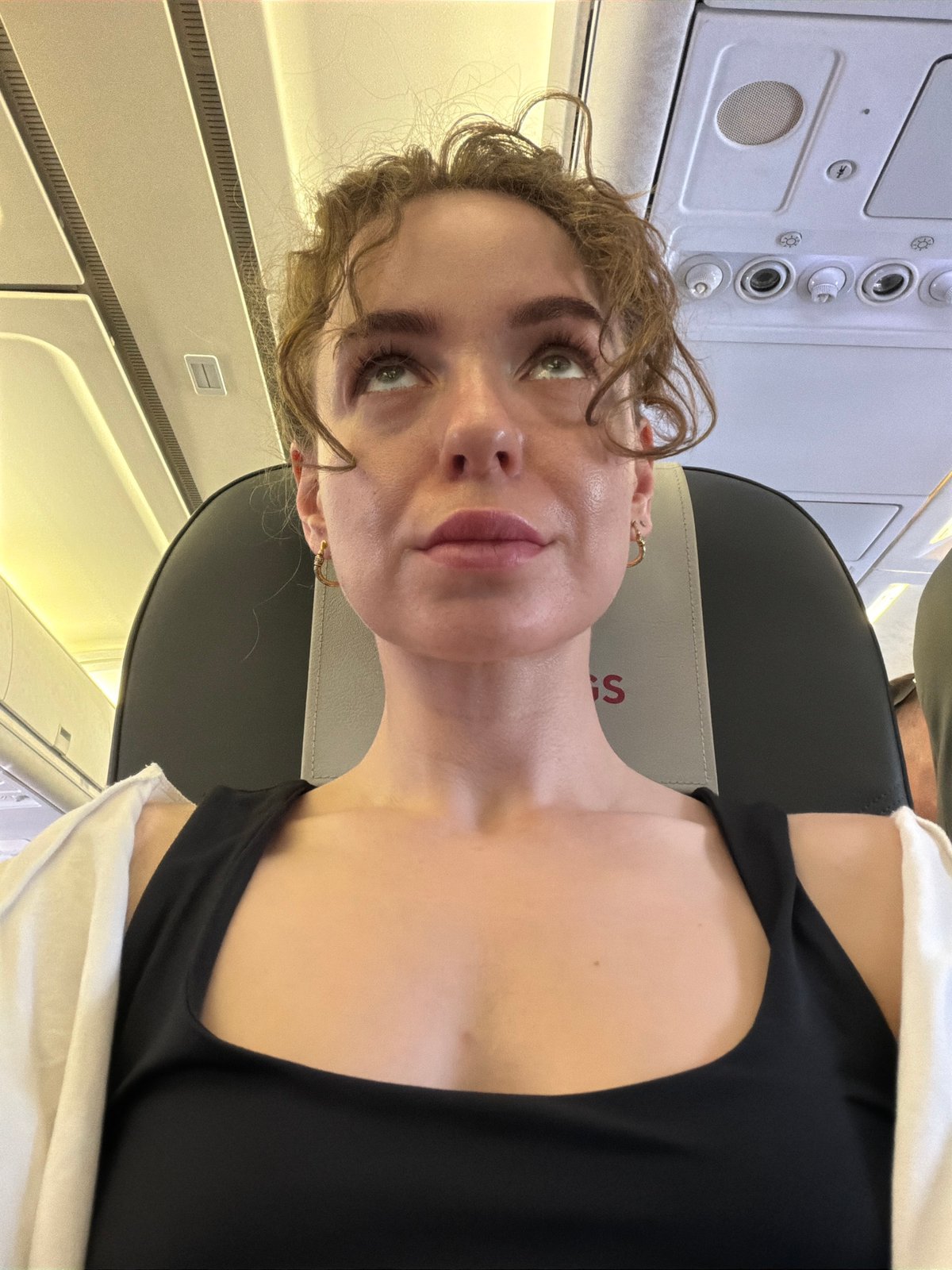 Woman seated in aircraft cabin in Zhukovsky, Russia