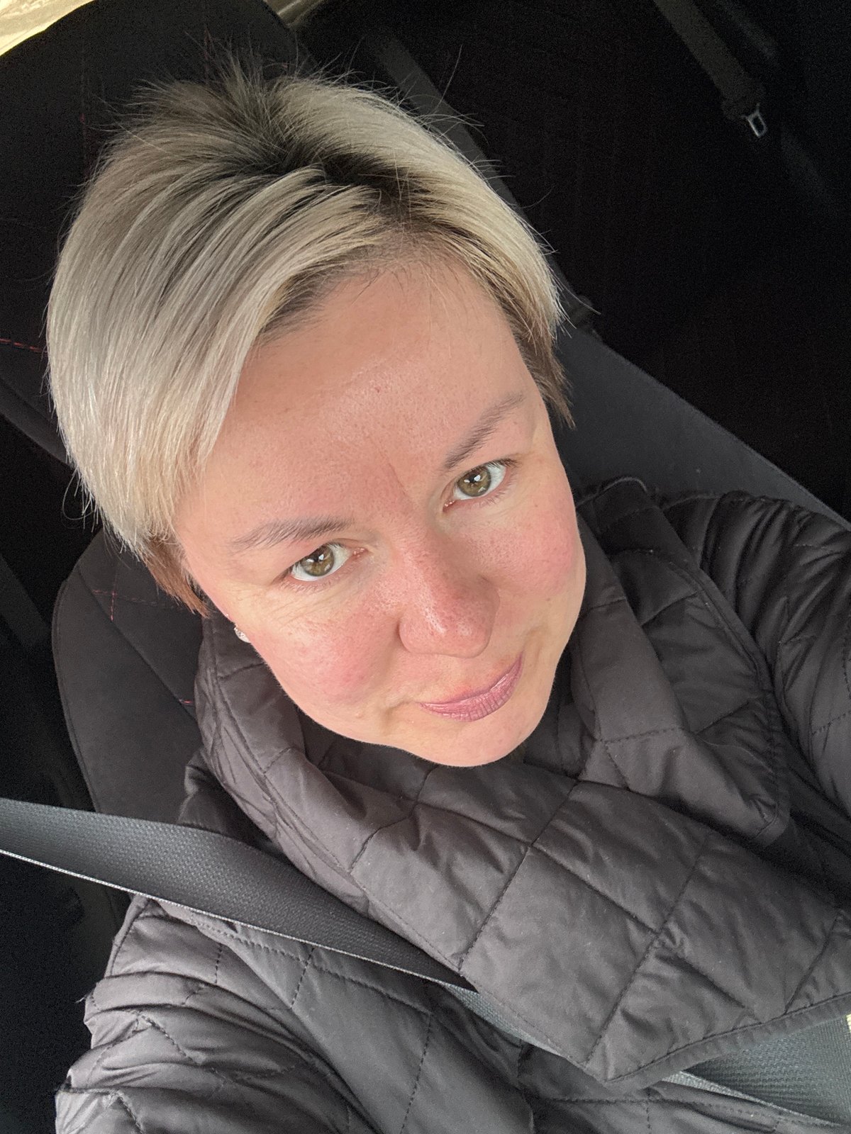 Woman observed in vehicle interior in rural Russia