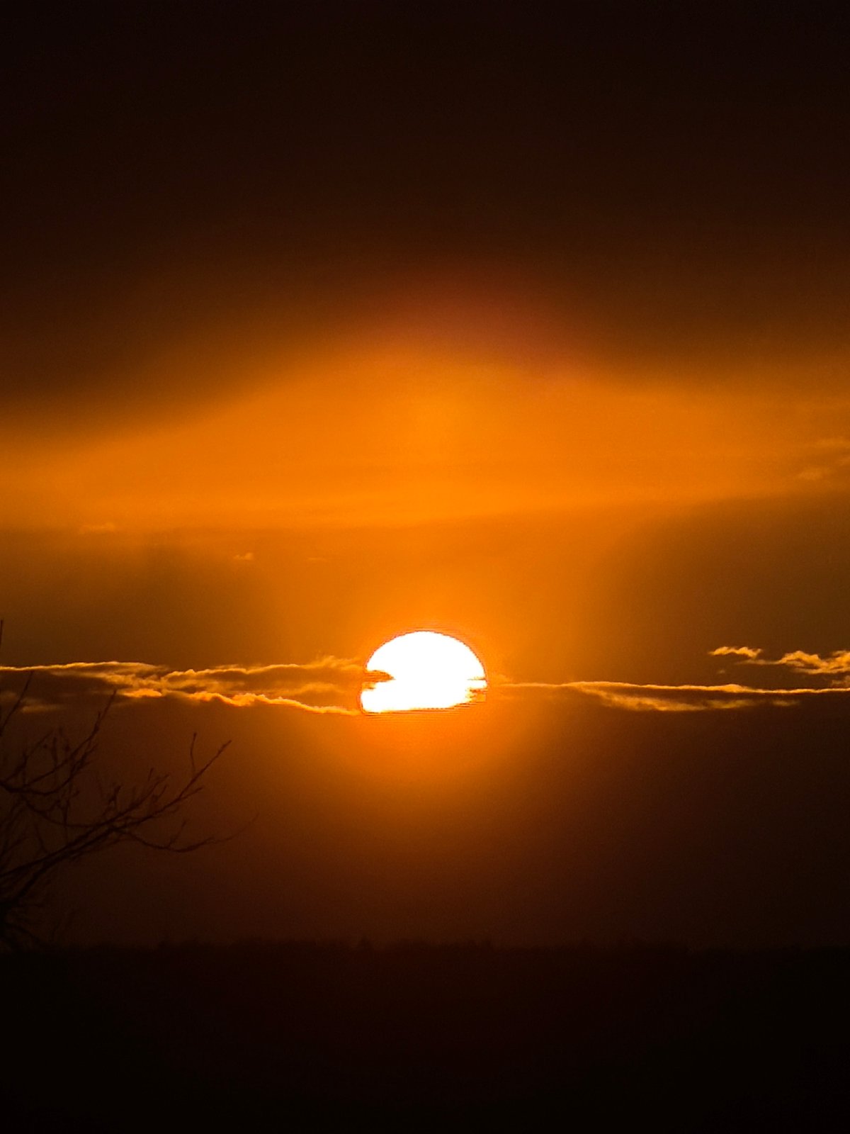 Dramatic sunset and visible moon captured in Chaikovsky, Russia