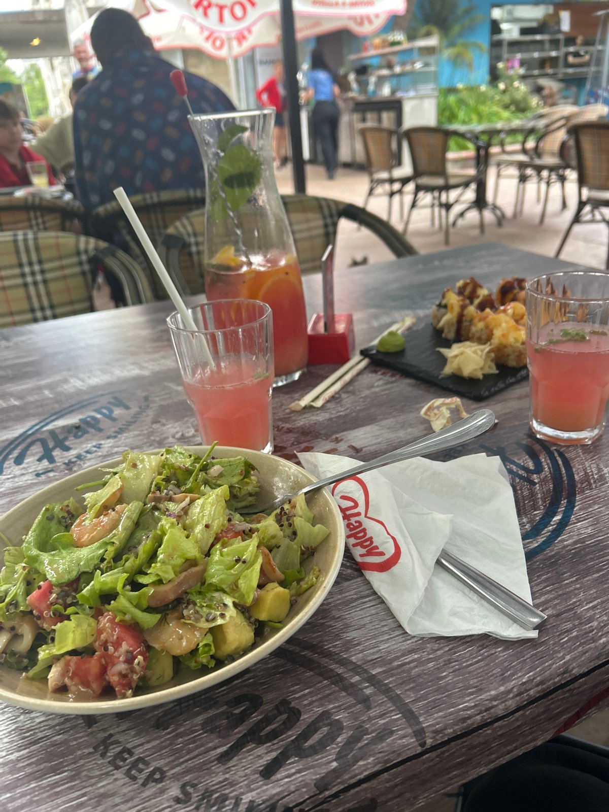 Outdoor lunch documented at Burgas restaurant with sushi and drinks