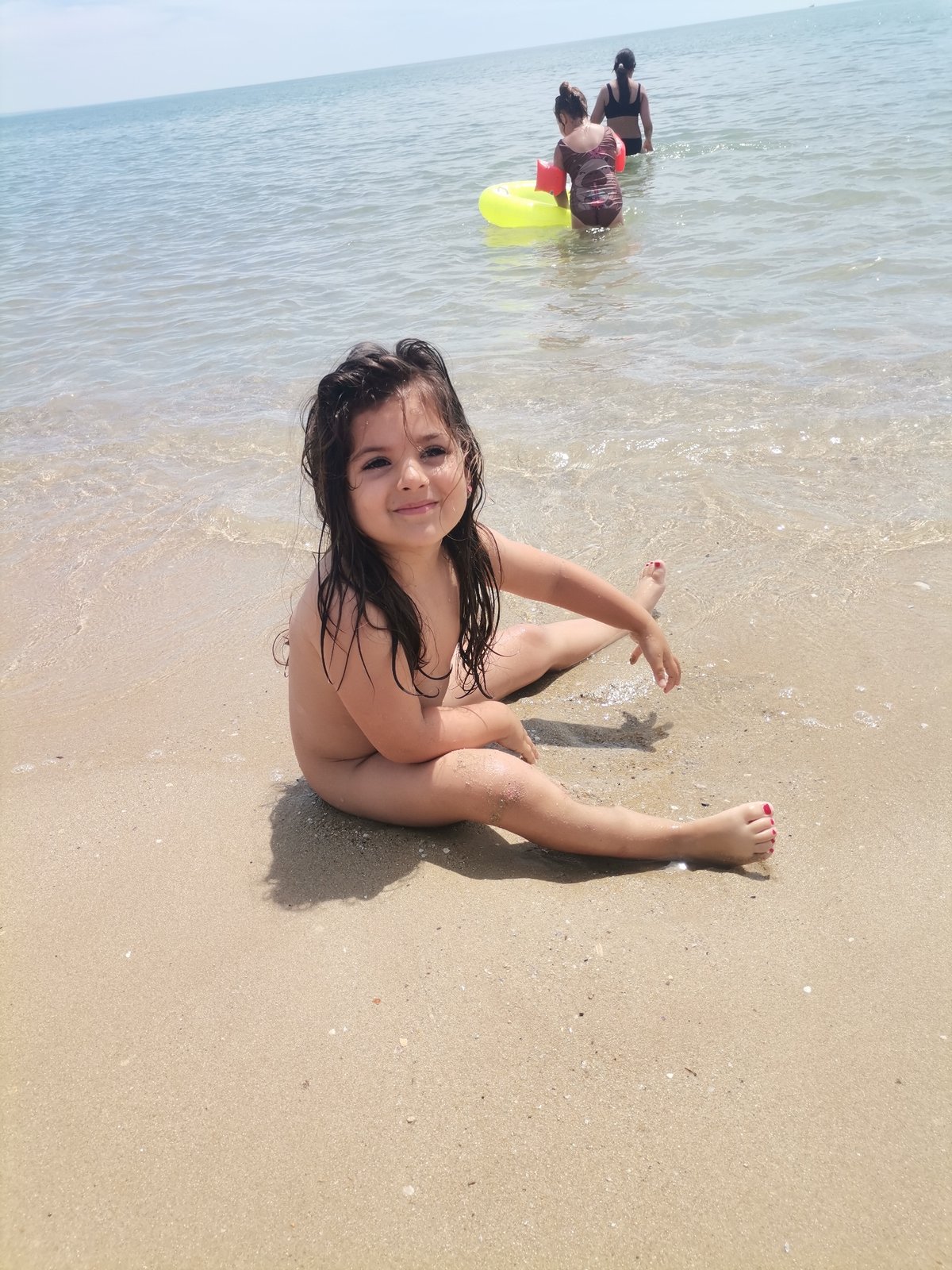 Summer morning at Kranevo beach, kids playing in the sea