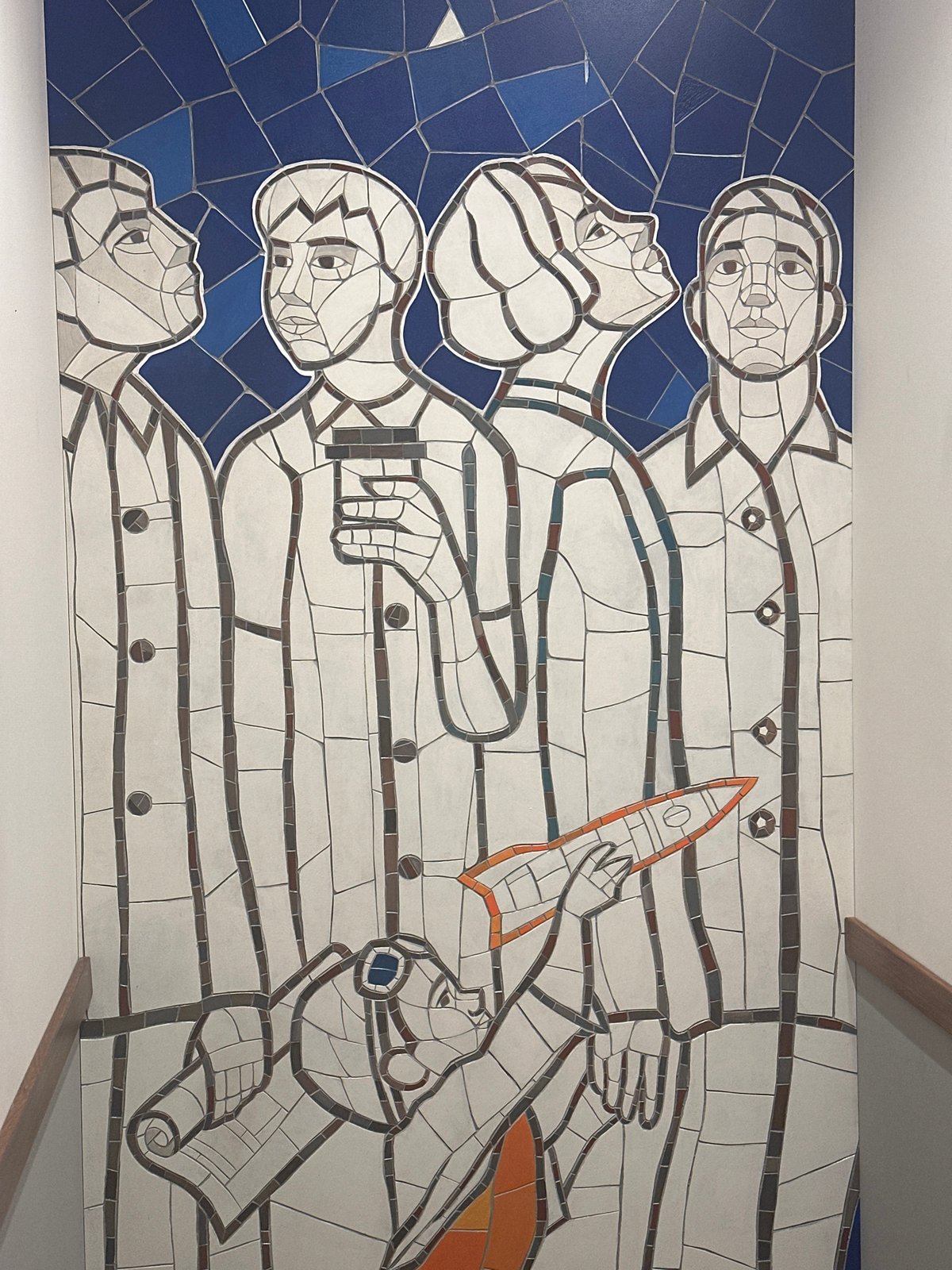 Mosaic mural and pink-haired selfie captured in Novosibirsk