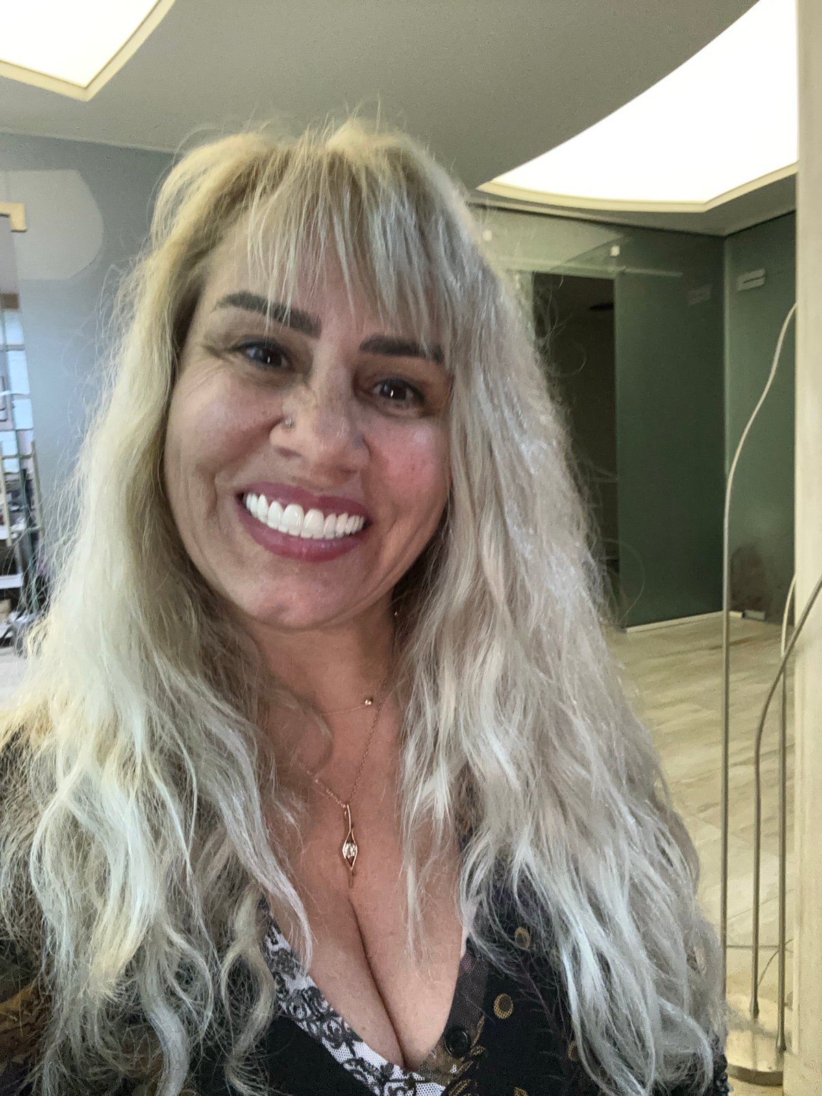 Woman photographed smiling in Sofia office setting