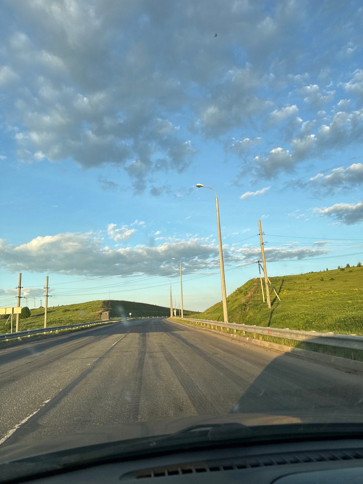 Vehicle travels rural road near Тарасово, Russia