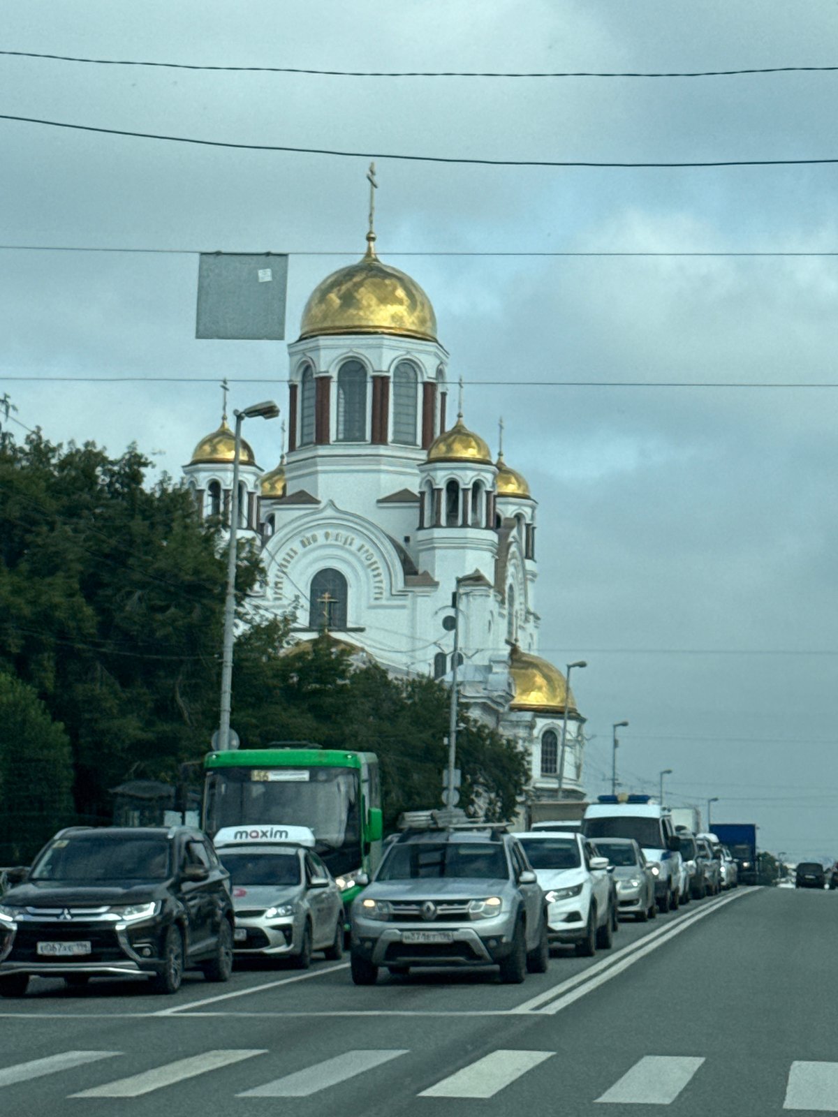 Traffic stop in Yekaterinburg with a golden-domed church in view