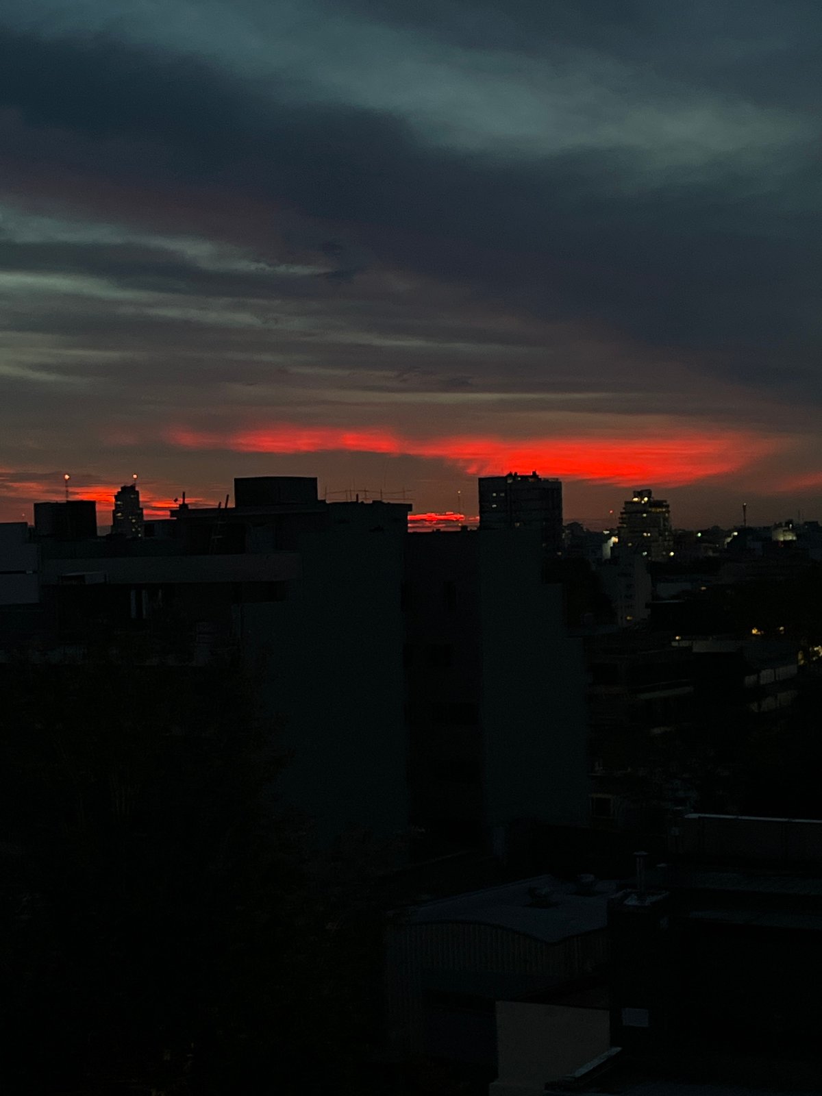 Sunset captured over Buenos Aires cityscape at dusk