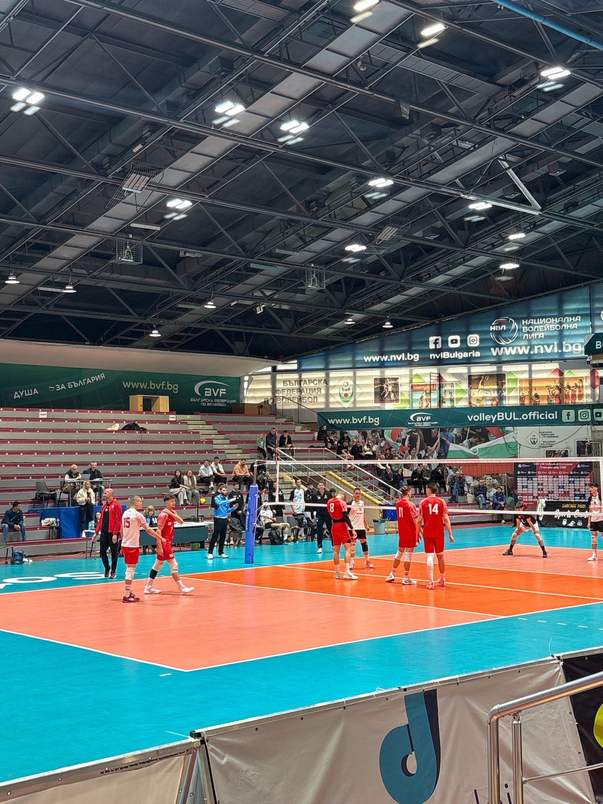 Indoor volleyball match observed at arena facility