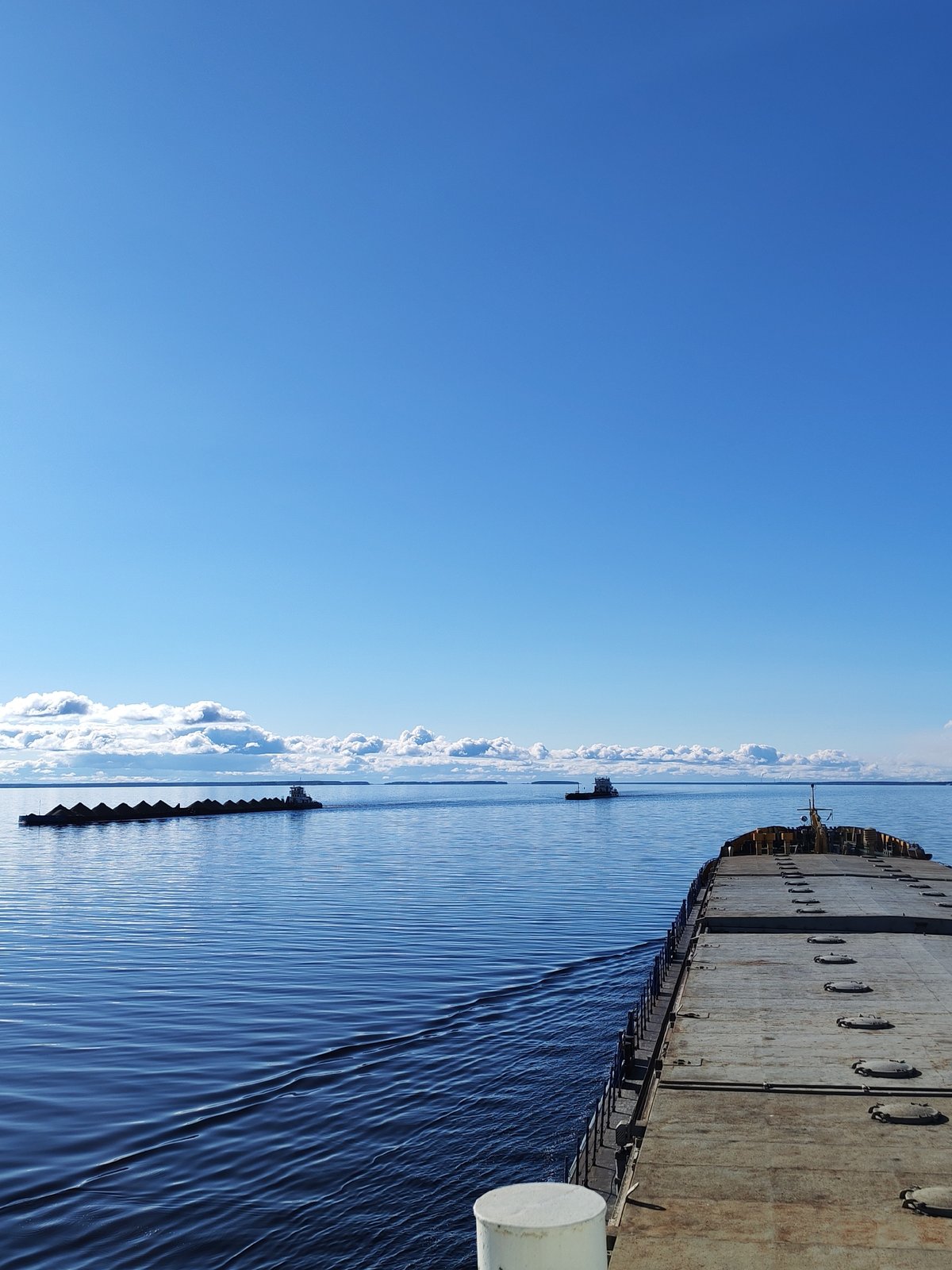 Tugboat tows cargo barge across Russian waters near Mikhalevo