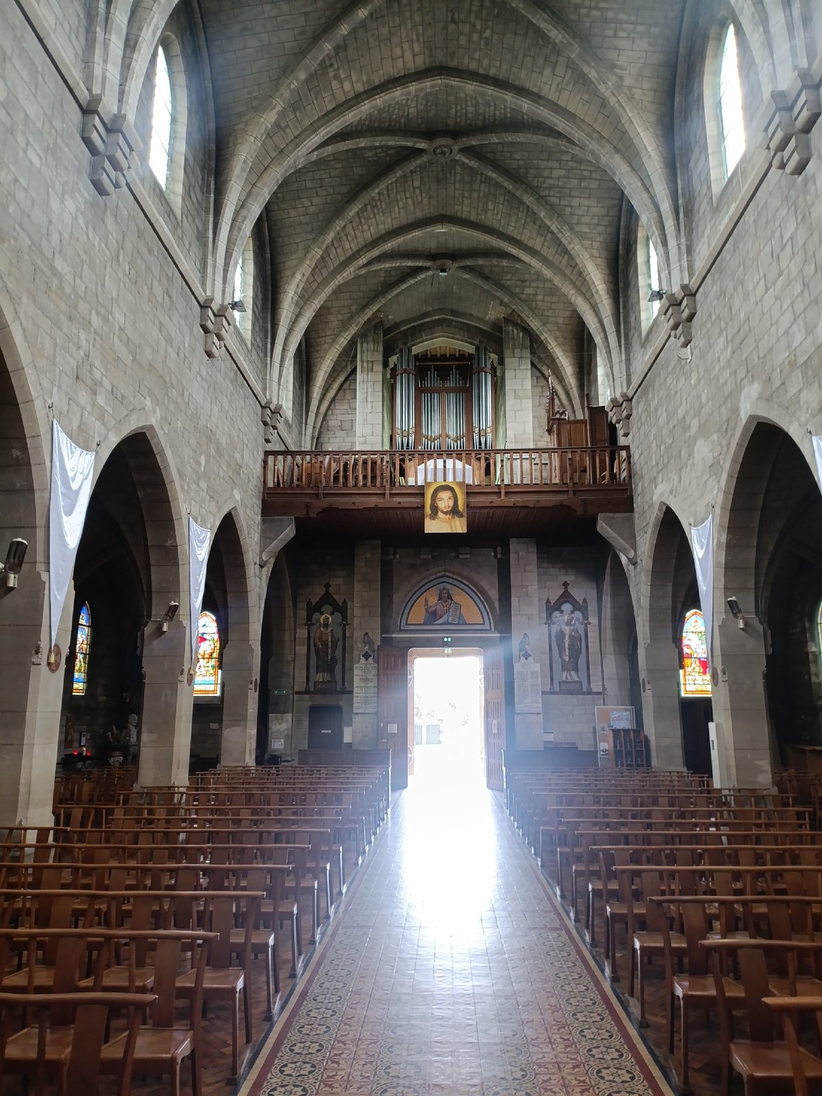 Inside and outside a Gothic stone cathedral on a cloudy morning